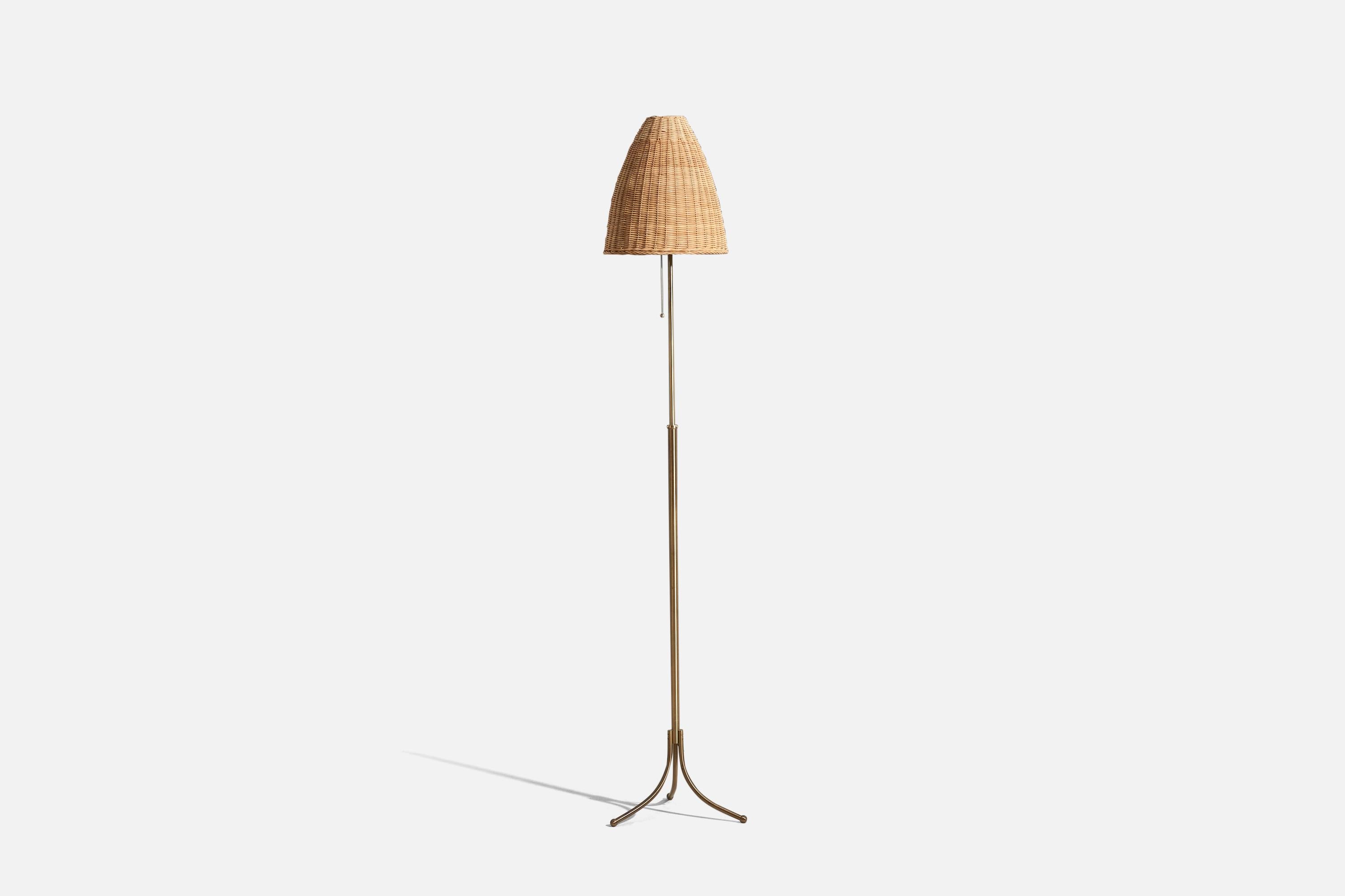 A brass and rattan floor lamp designed by Josef Frank and produced by Svenskt Tenn, Sweden, 1950s.