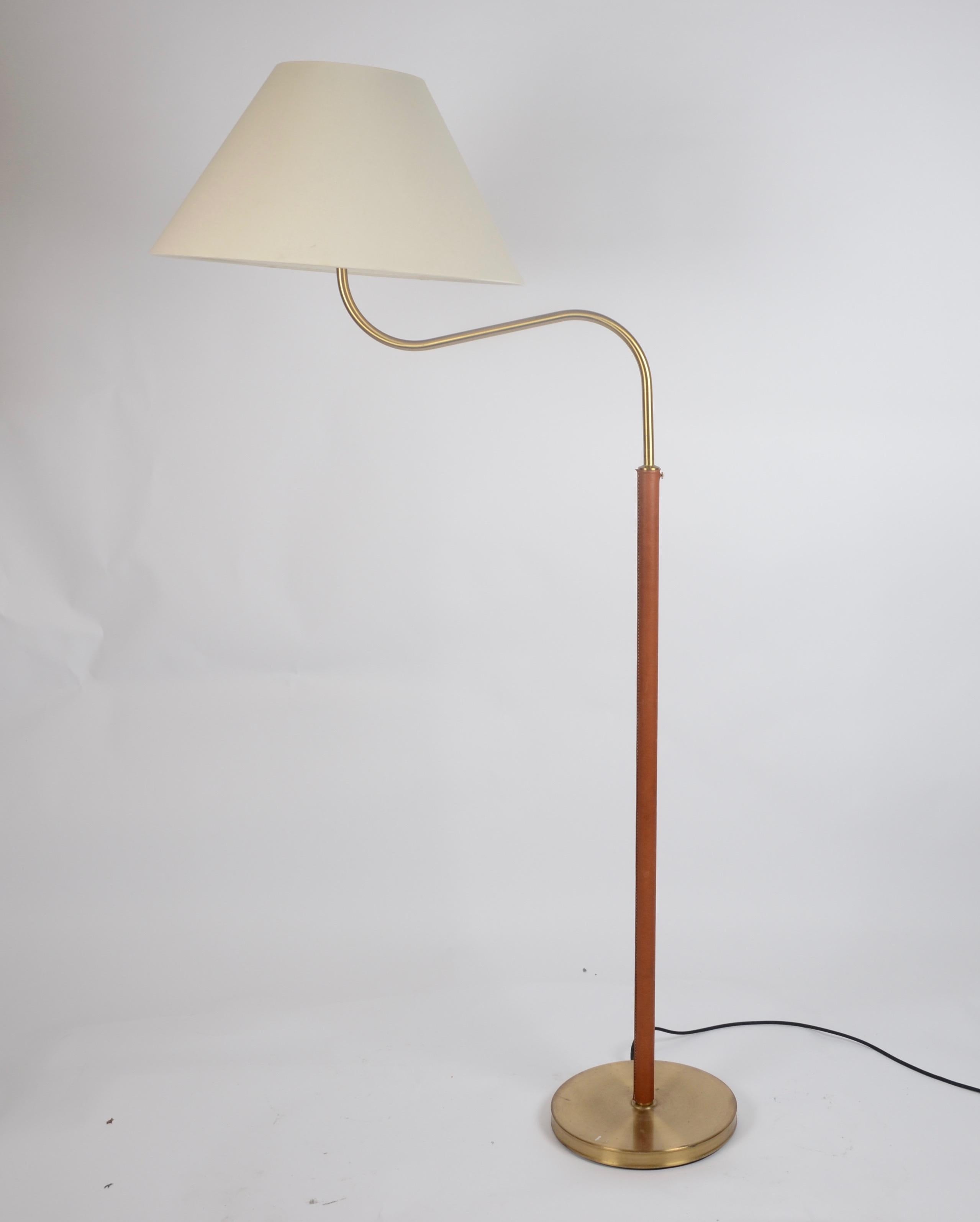 Floor lamp model G 2368, also known as the big camel, designed by Josef Frank in 1939 for Firma Svenskt Tenn. Sweden, mid-1900s. Made in brass and leather.