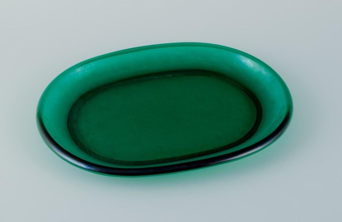 Josef Frank for Reijmyre, Sweden. 
Two lobster plates in green art glass.
Approximately from the 1960s/1970s.
In excellent condition with normal signs of use.
Dimensions: L 30.5 cm x W 23.0 cm.