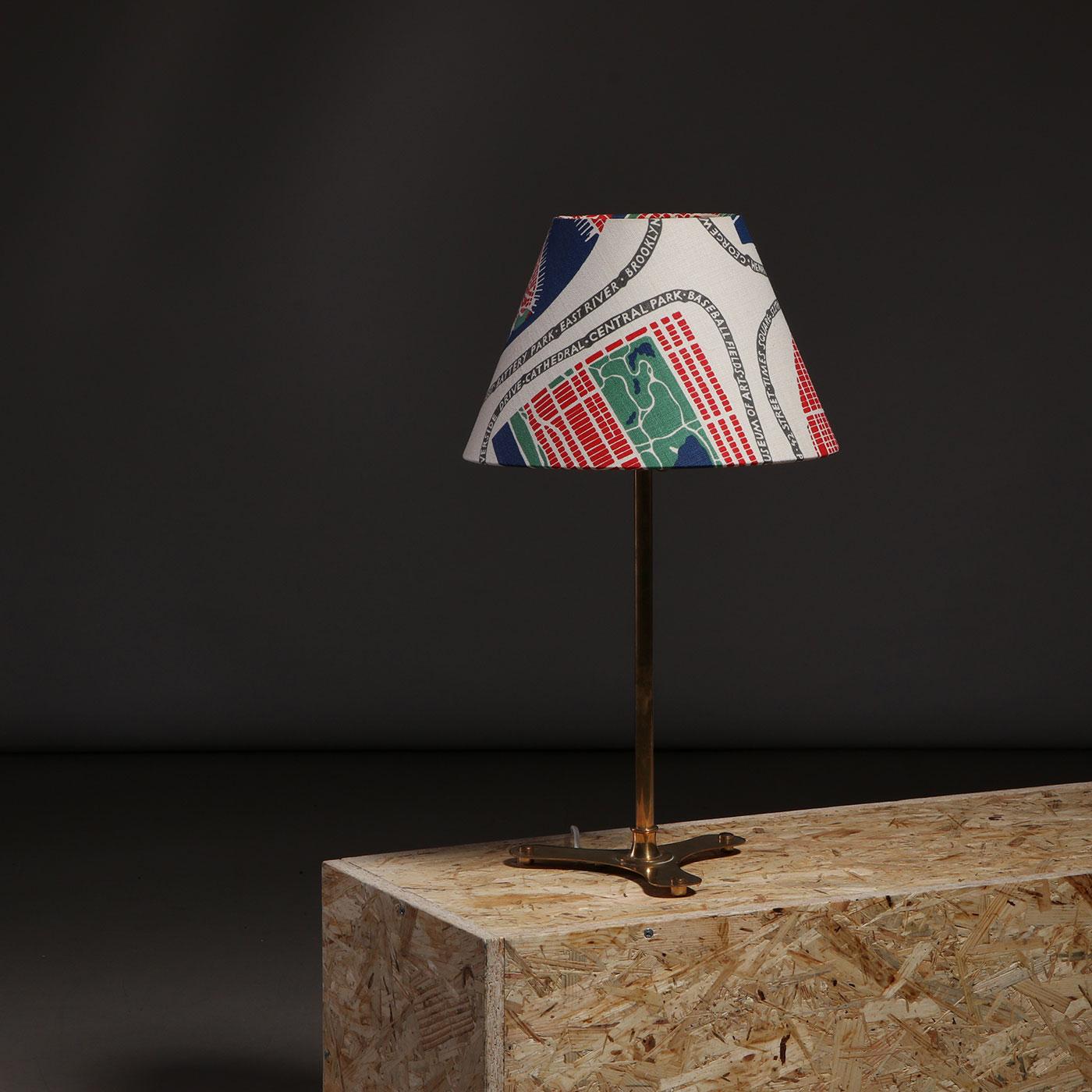 Brass table lamp, model 2467, designed by Josef Frank for Svenskt Tenn in Sweden, 1950s.

This elegant and rare Swedish table lamp was designed in the 1950s by renowned Austrian-born architect and designer Josef Frank for Svenskt Tenn. The lamp
