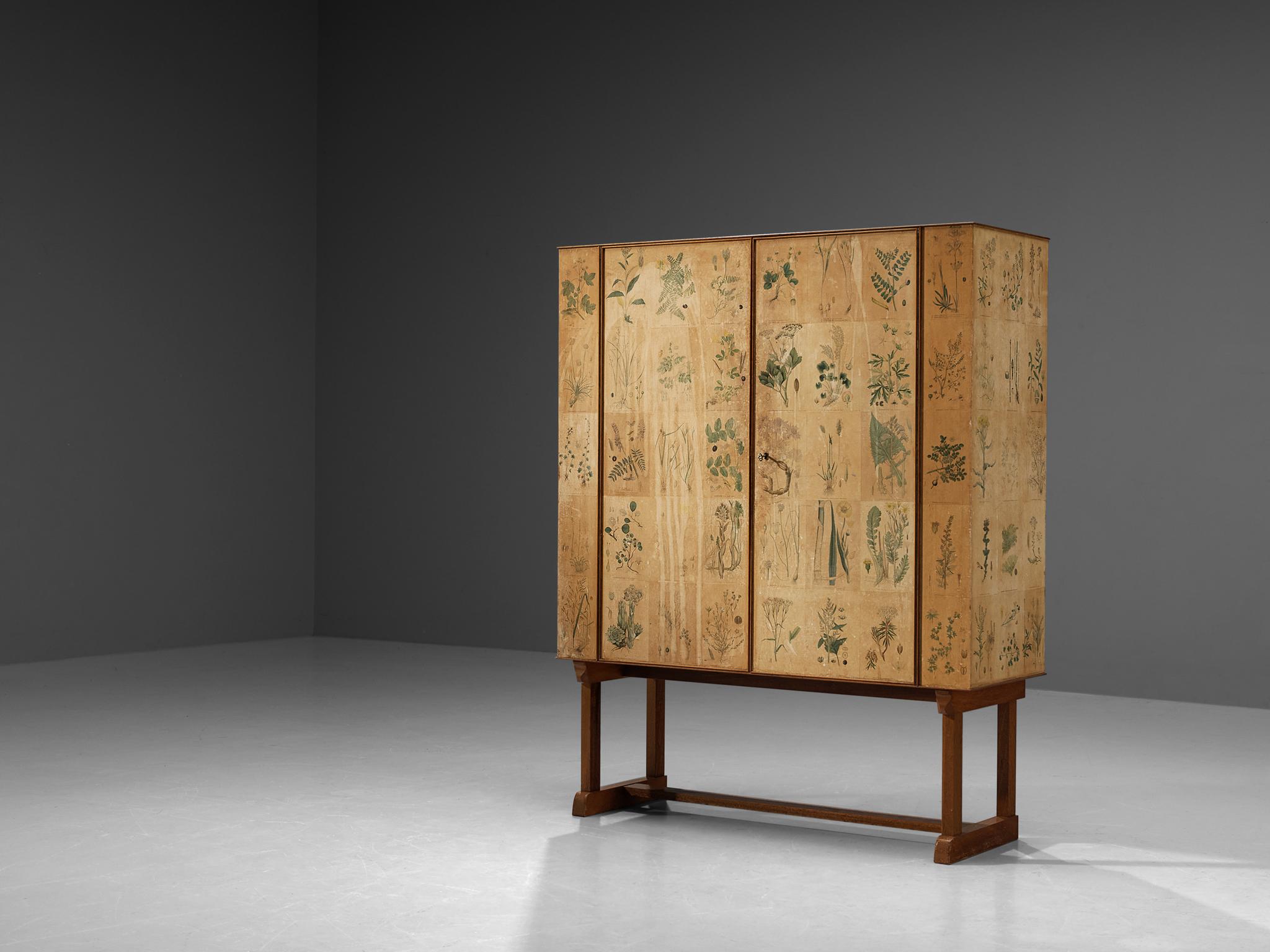 Josef Frank for Svenskt Tenn, cabinet ‘Flora’, early edition model 852, mahogany, oak, hand-colored paper, Sweden, designed circa 1937/38, produced 1946/47s. 

This cabinet follows Frank’s idea to design the surfaces of cabinets in a different,