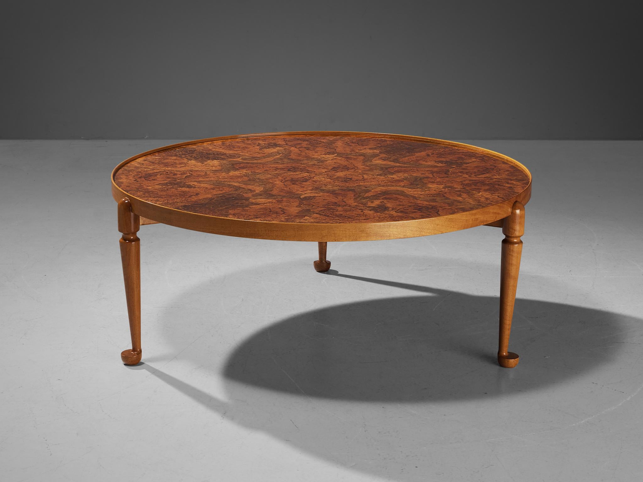 Josef Frank for Svenskt Tenn, coffee table model 2139, walnut burl top, walnut legs, maple rim, Sweden, design 1948

This classic coffee table is designed by Josef Frank in 1948. This specific coffee table is produced circa 1955, meaning that it is