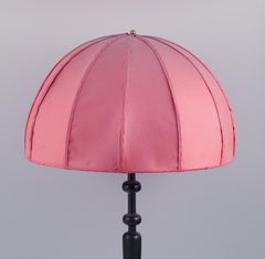 Josef Frank for Svenskt Tenn, Sweden.  Large table lamp with pink fabric shade.