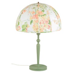 Josef Frank for Svenskt Tenn. Table lamp, turned wooden base and floral shade.