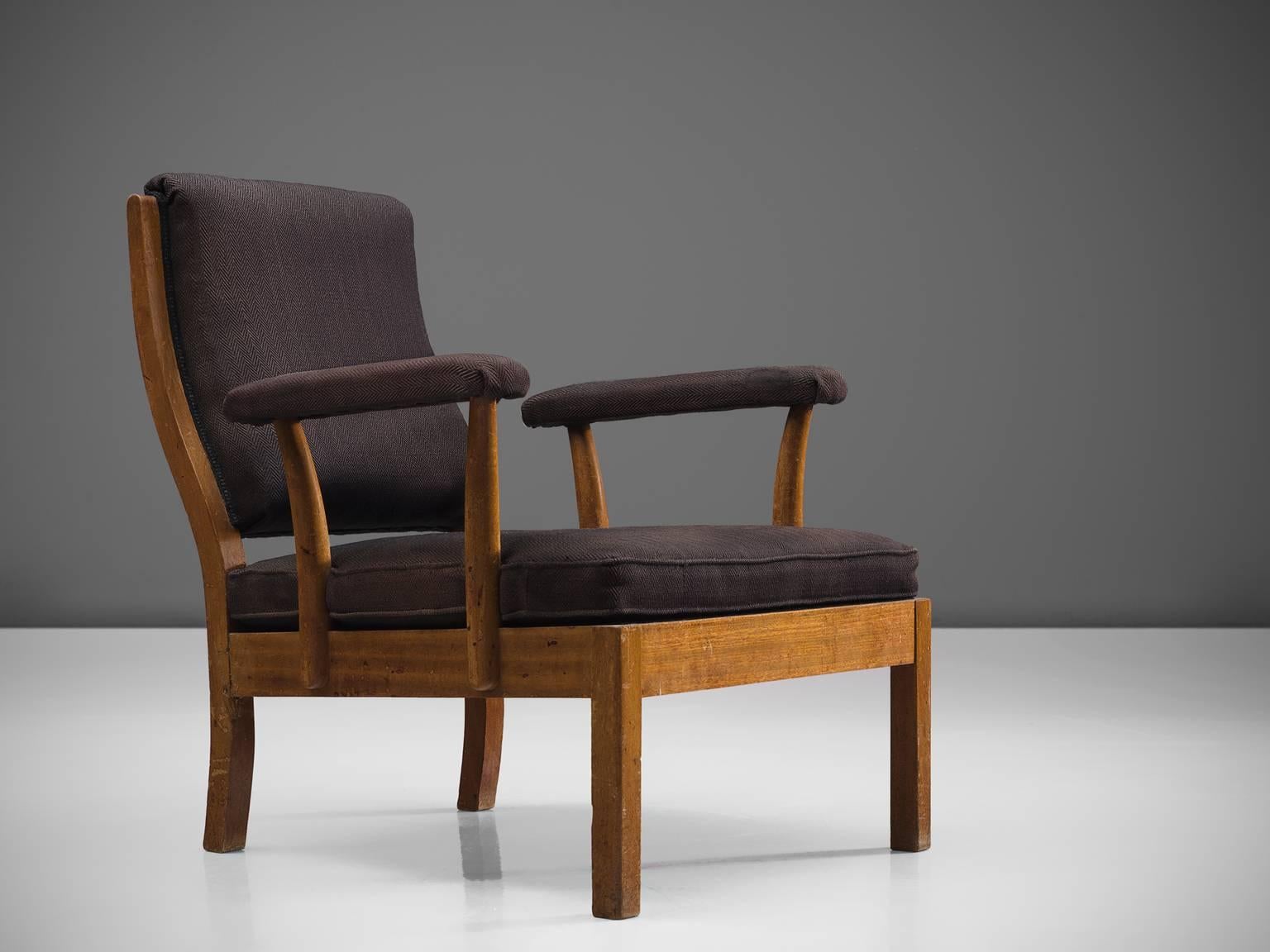 Josef Frank for Svenskt Tenn, armchair 352, brown fabric and mahogany, Sweden, design 1933, production 1934. 

This lounge chair by Josef Frank is produced by the firm Svenskt Tenn. The chair features a very deep seat and a relatively short back