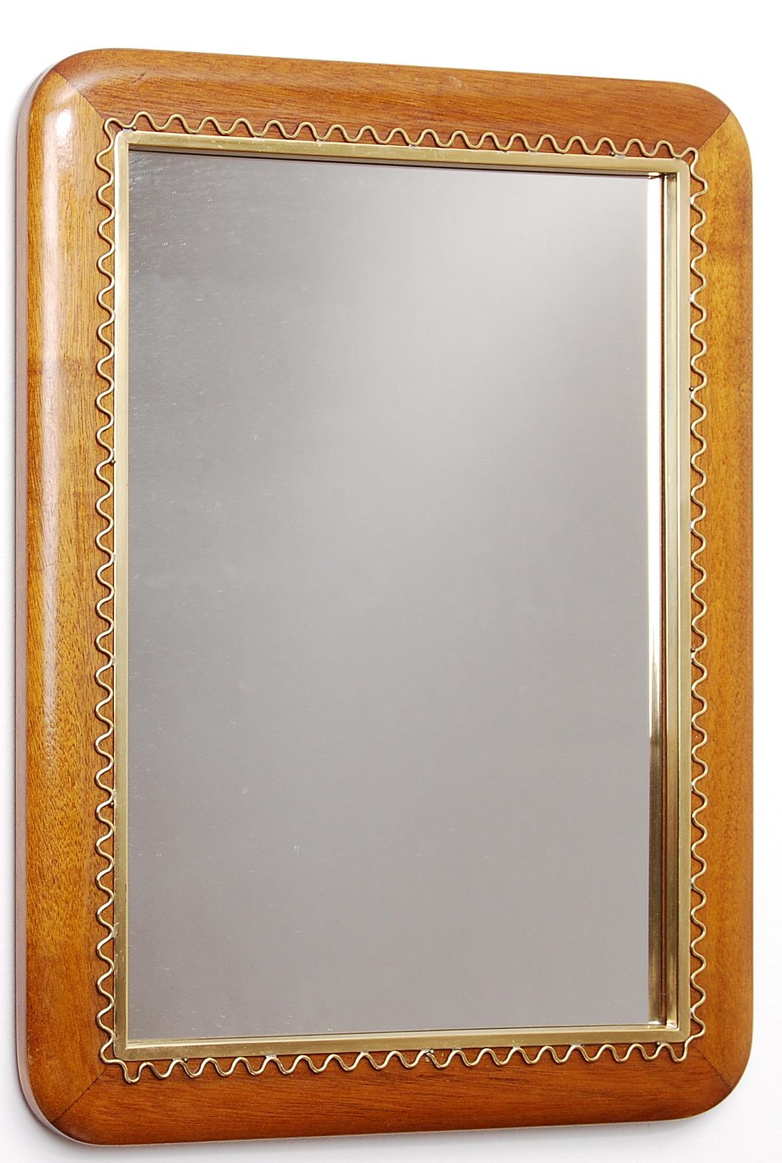 A mirror for table or wall in brass and stained oak. Designed by Josef Frank for Firma Svenskt Tenn.
   