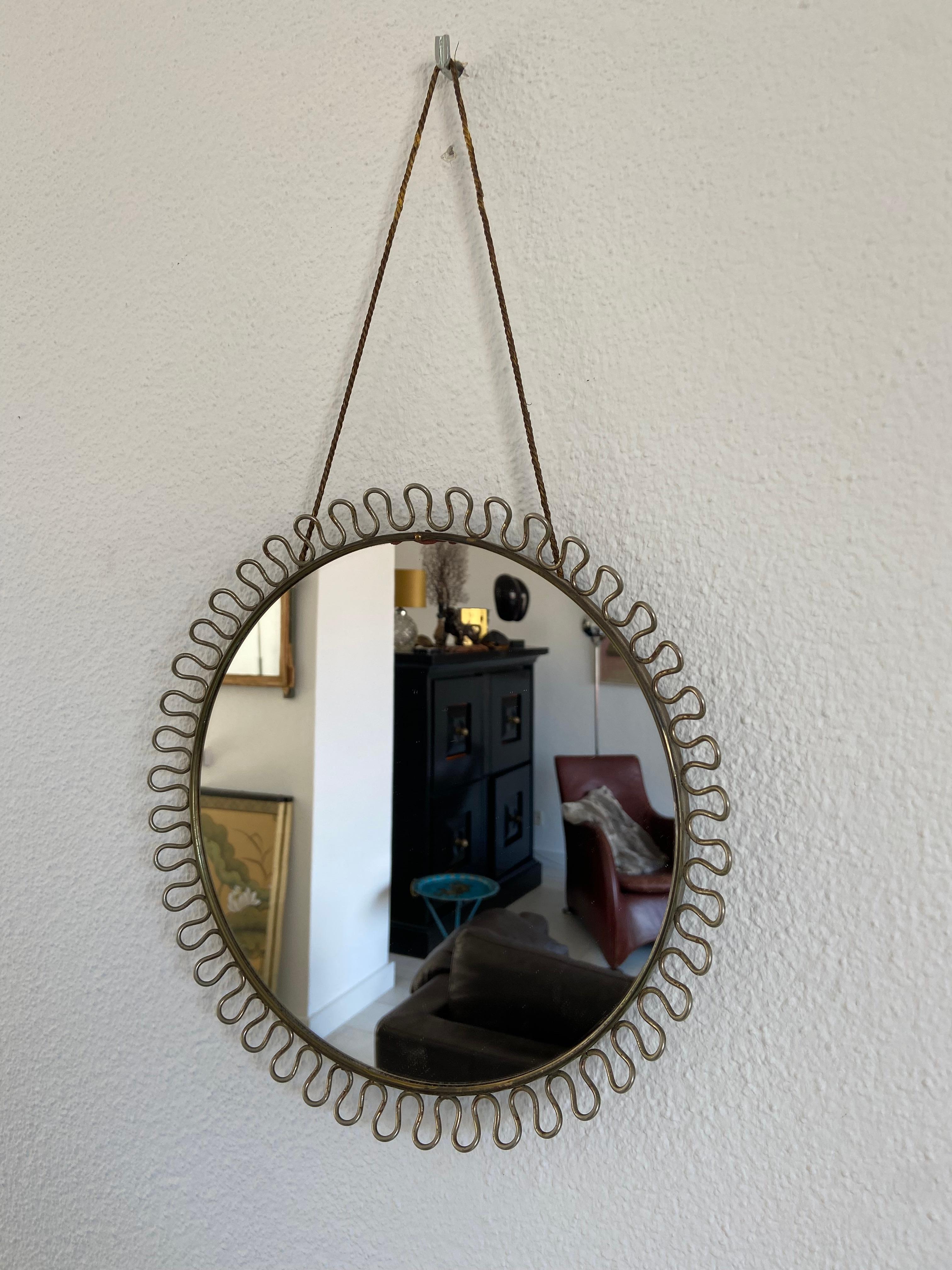 Josef Frank mirror in brass with the original hanging rope.