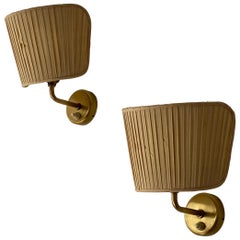 Josef Frank, Sconces / Wall lights, brass, fabric, Svenskt Tenn, Sweden, 1950s