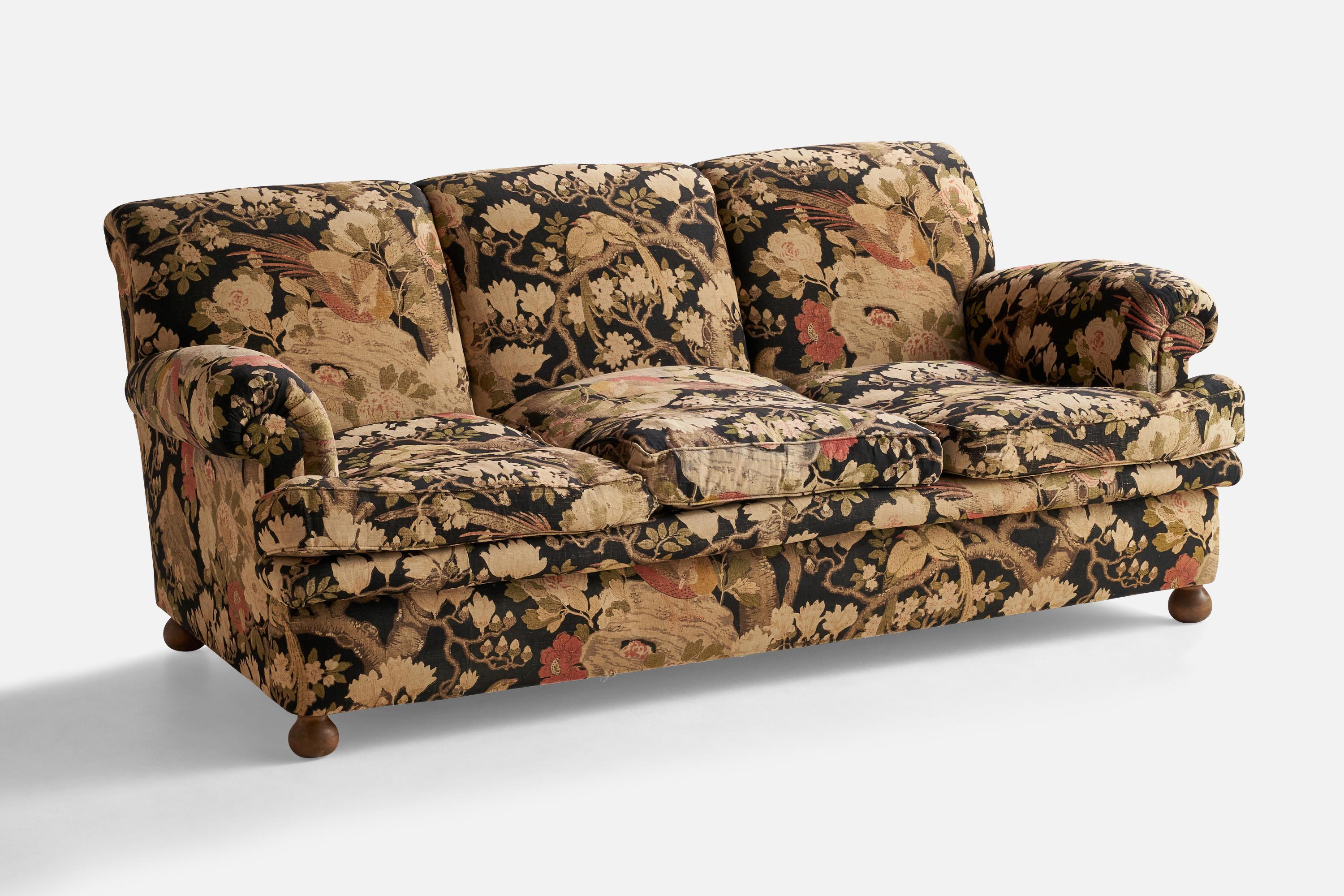 An earl mahogany and floral fabric sofa, Model 703, designed by Josef Frank and produced by Svenskt Tenn, Sweden, 1940s.

Seat height: 17.5”
