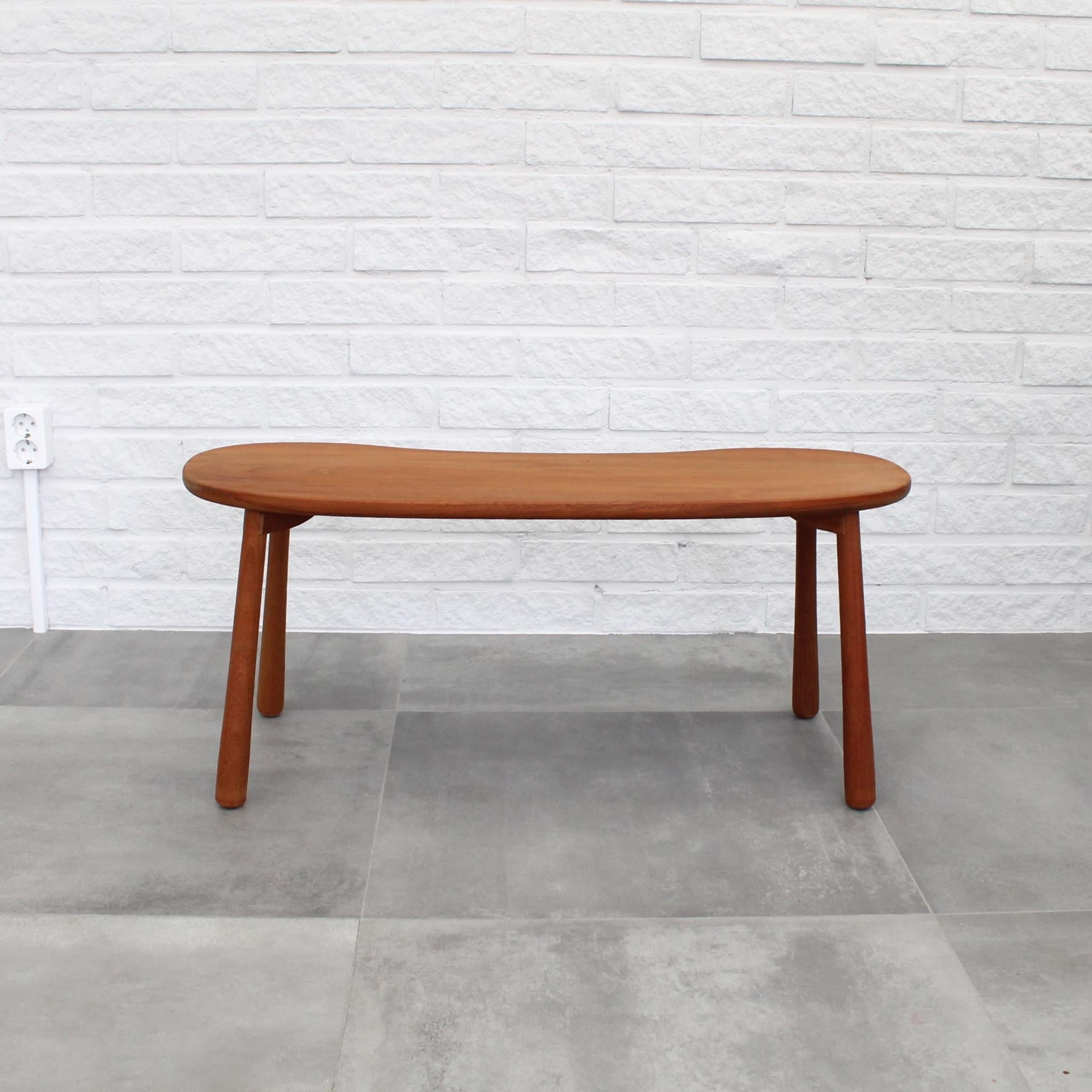 Stool model 1034, designed by Josef Frank for Firma Svenskt Tenn. Its versatile design makes it suitable for use as both a stool and a low organic side table. Crafted from solid mahogany, this model, often called the 