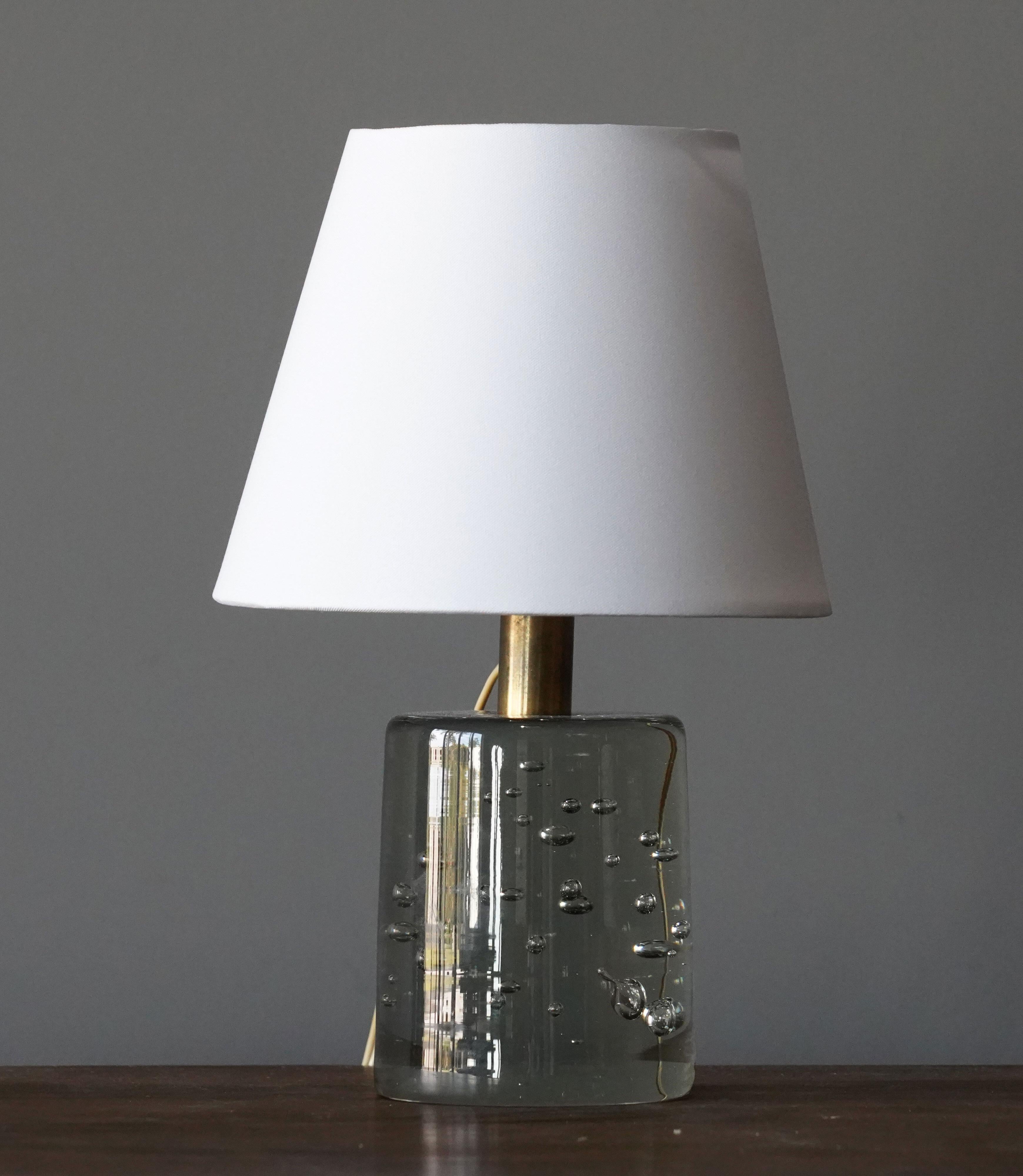 An early table lamp by Josef Frank, in brass and studio glass from Reijmyre Glasbruk. Produced by Svenskt Tenn, 1960s.

Sold without lampshade. Stated dimensions excluding lampshade.

Other lighting designers of the period include Hans-Agne