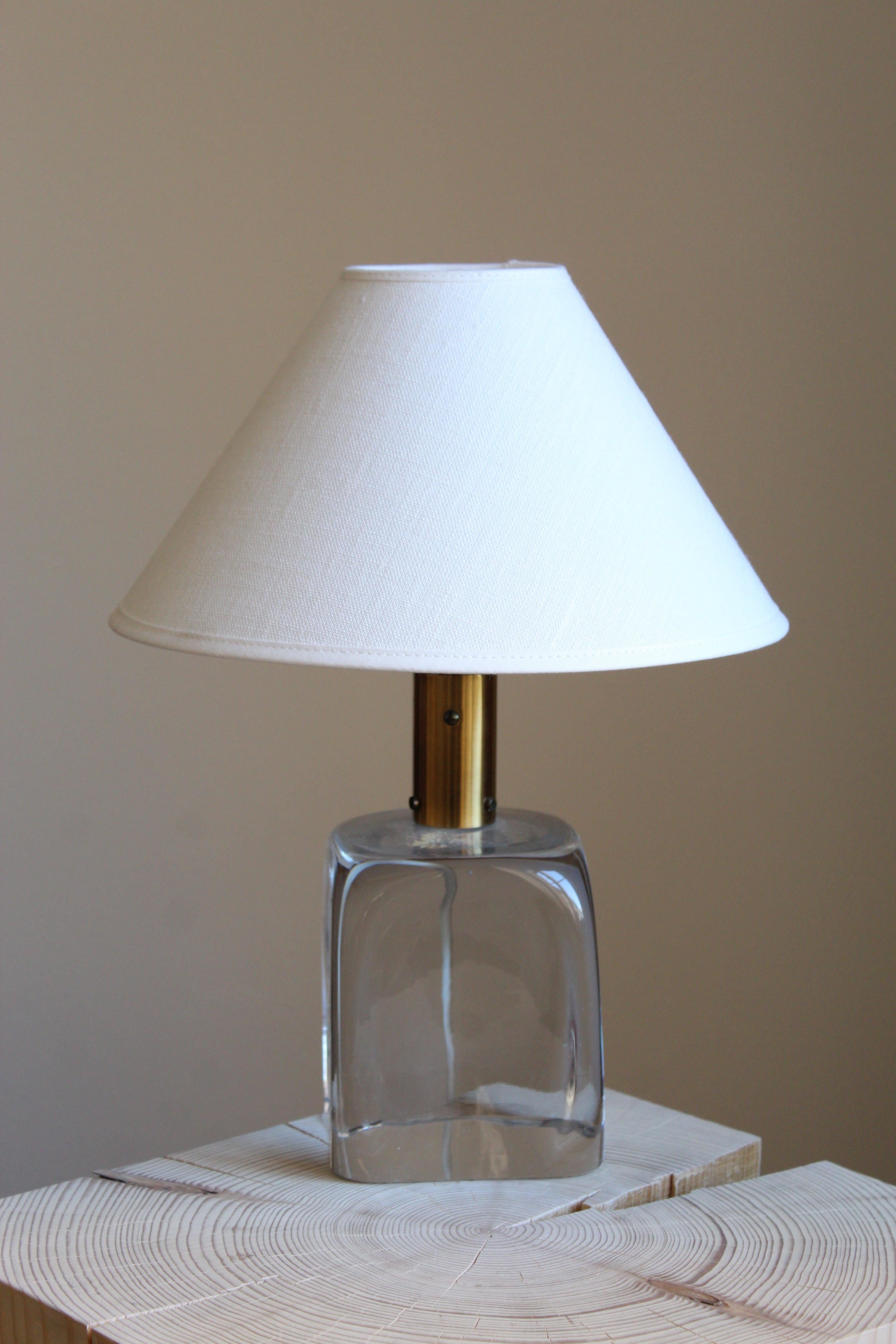 An early table lamp by Josef Frank, in brass and studio glass from Reijmyre Glasbruk. Produced by Svenskt Tenn, 1960s.

Stated dimensions excluding lampshade. Sold without lampshade.

Other lighting designers of the period include Hans-Agne