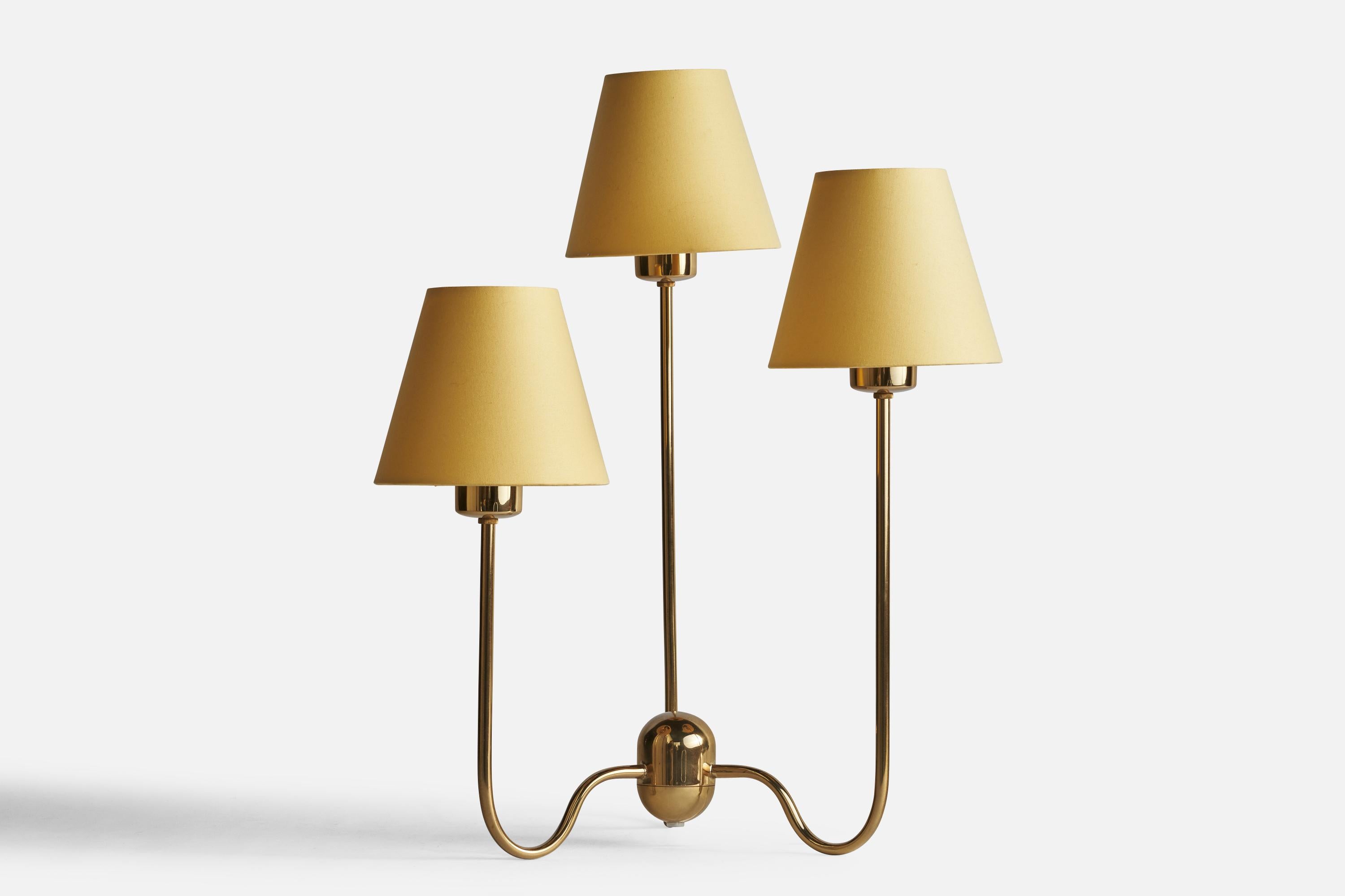A brass and yellow fabric table lamp designed by Josef Frank, c. 1930s, this example produced by Svenskt Tenn, c. 1990s.

Overall Dimensions (inches): 20.45” H x 15.75” x 14.75” D
Bulb Specifications: E-26 Bulb
Number of Sockets: 3
All lighting will