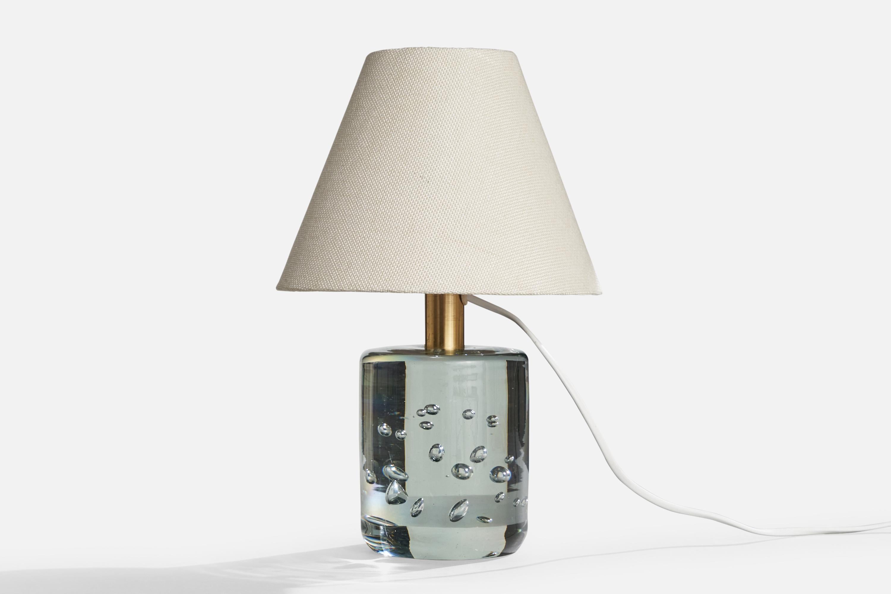 A brass and blown glass table lamp designed by Josef Frank and produced by Svenskt Tenn, Sweden, c. 1950s.

Dimensions of Lamp (inches): 9“ H x 4“ Diameter

Dimensions of Shade (inches): 3.5“ Top Diameter x 8“ Bottom Diameter x 6“ H

Dimensions of
