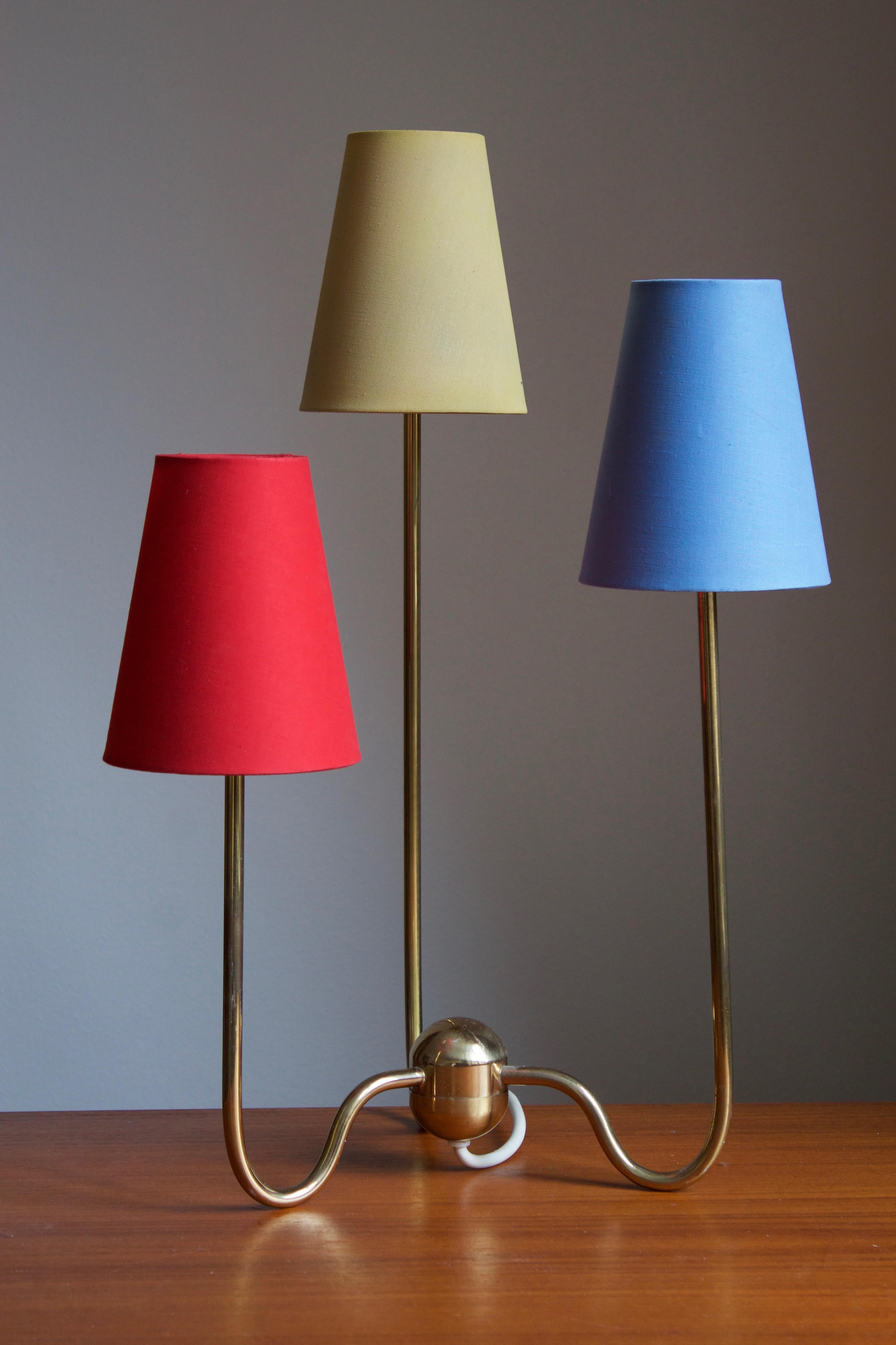 An example of Josef Franks 3-armed table lamp for Svenskt Tenn, Stockholm, Sweden. Vintage example produced the fourth quarter of 20th century.

Other lighting designers of the period include Paavo Tynell, Alvar Aalto, Serge Muille, and Angelo