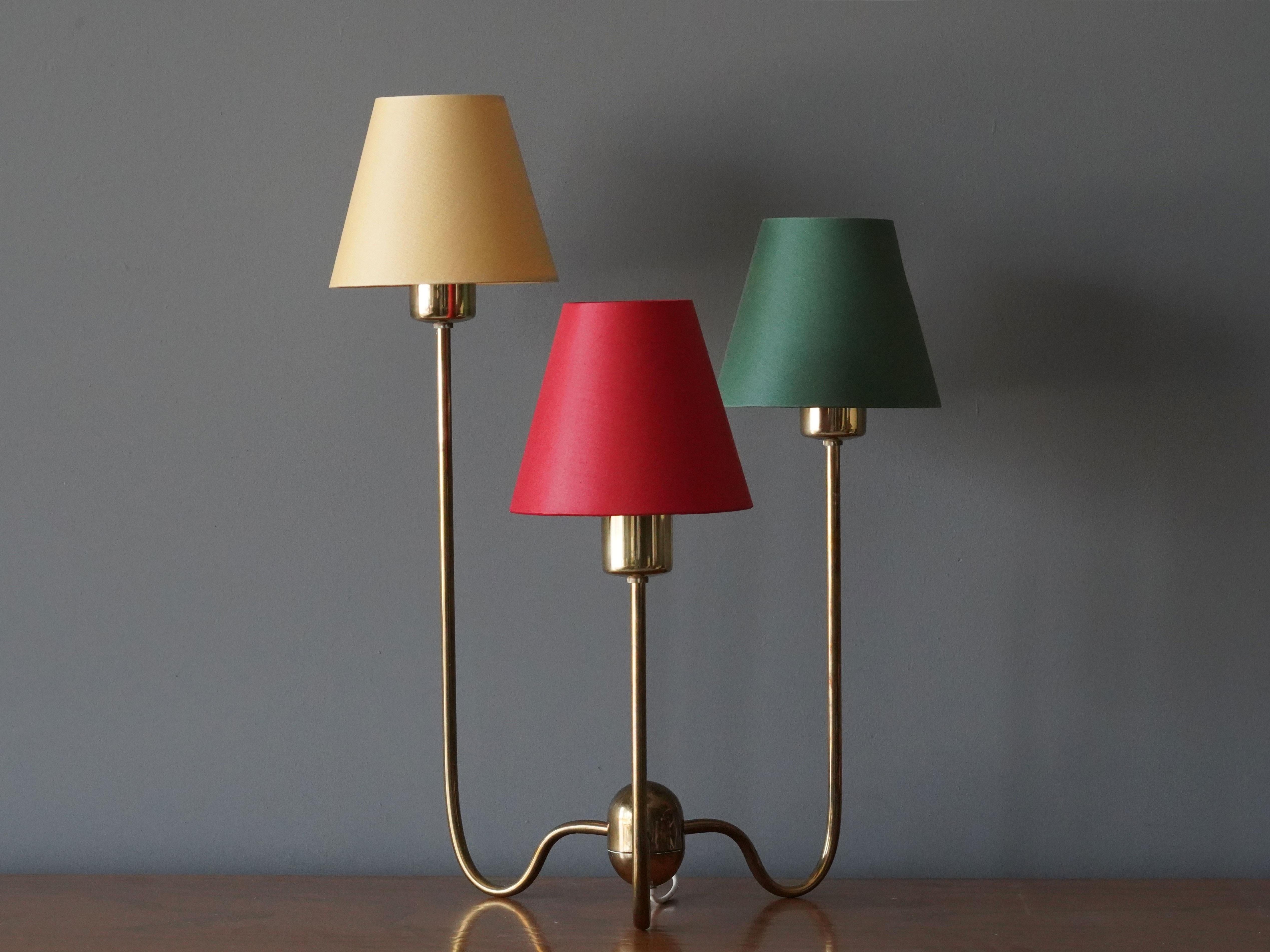 An early example of Josef Franks 3-armed table lamp for Svenskt Tenn, Stockholm, Sweden, circa 1960s.

Other lighting designers of the period include Paavo Tynell, Alvar Aalto, Serge Muille, and Angelo Lelii.
