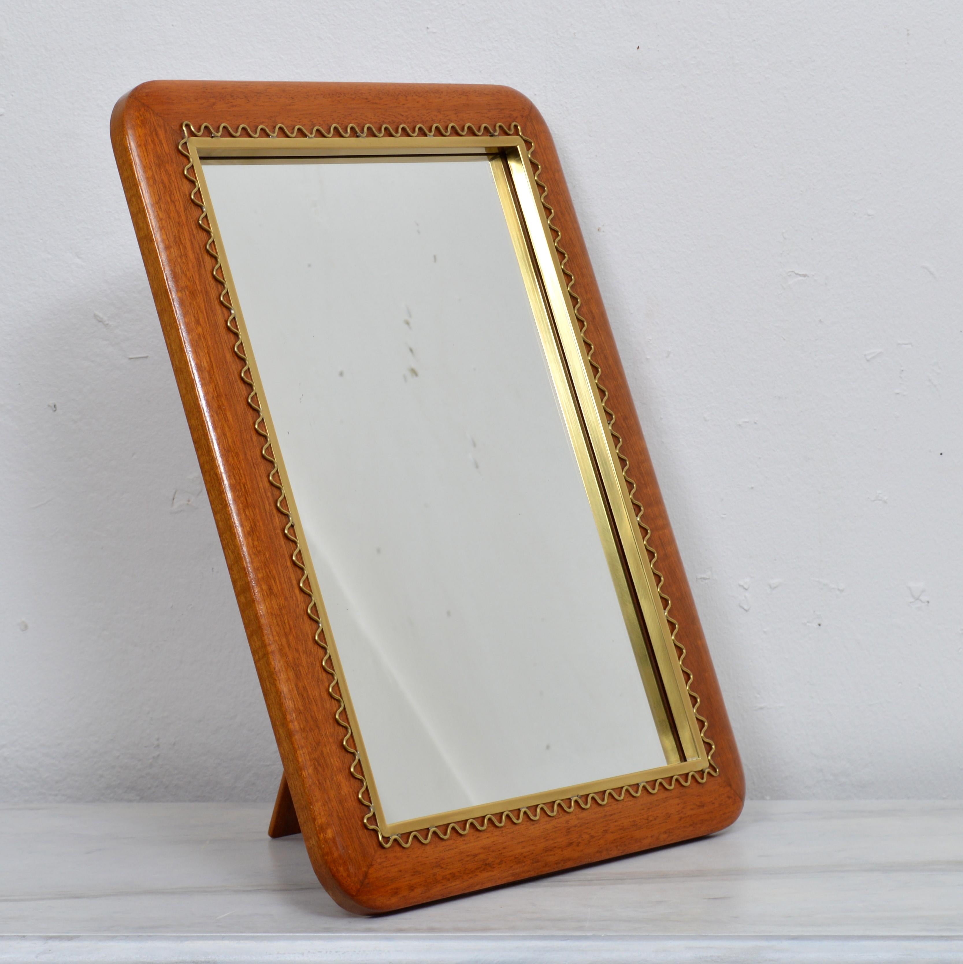 A mirror for table or wall in brass and stained walnut. Designed by Josef Frank for Firma Svenskt Tenn in the 1950s. Excellent vintage condition.
   