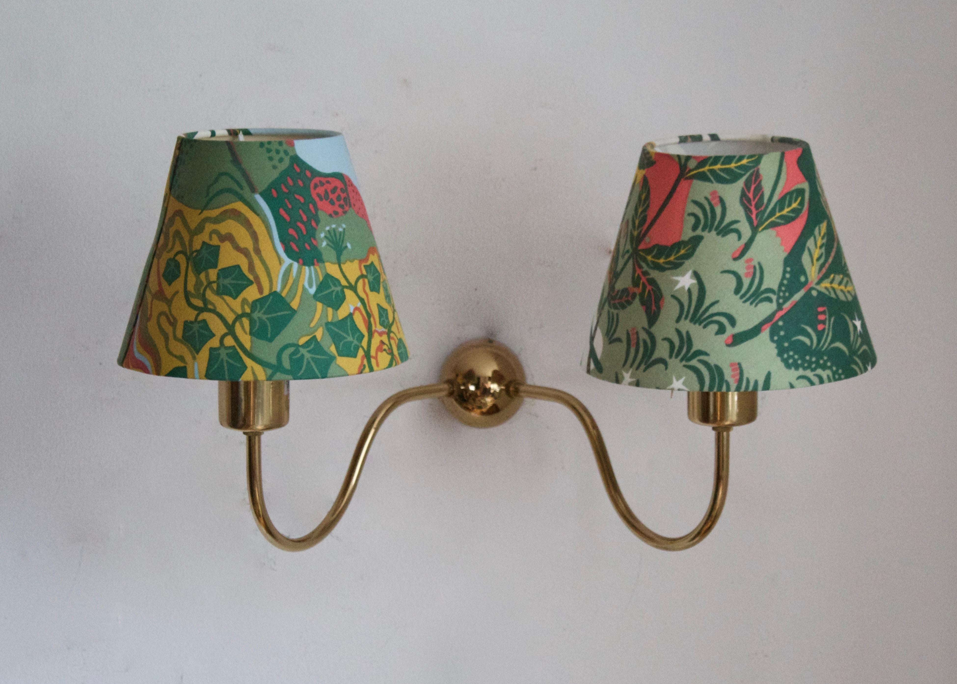 A wall light / sconce. Designed by Josef Frank, produced by Svenskt Tenn, Stockholm, Sweden. Designed in the 1920s, example produced c. 1970s. Lampshade pattern designed by Josef Frank.

Other designers of the period include Paavo Tynell, Lisa