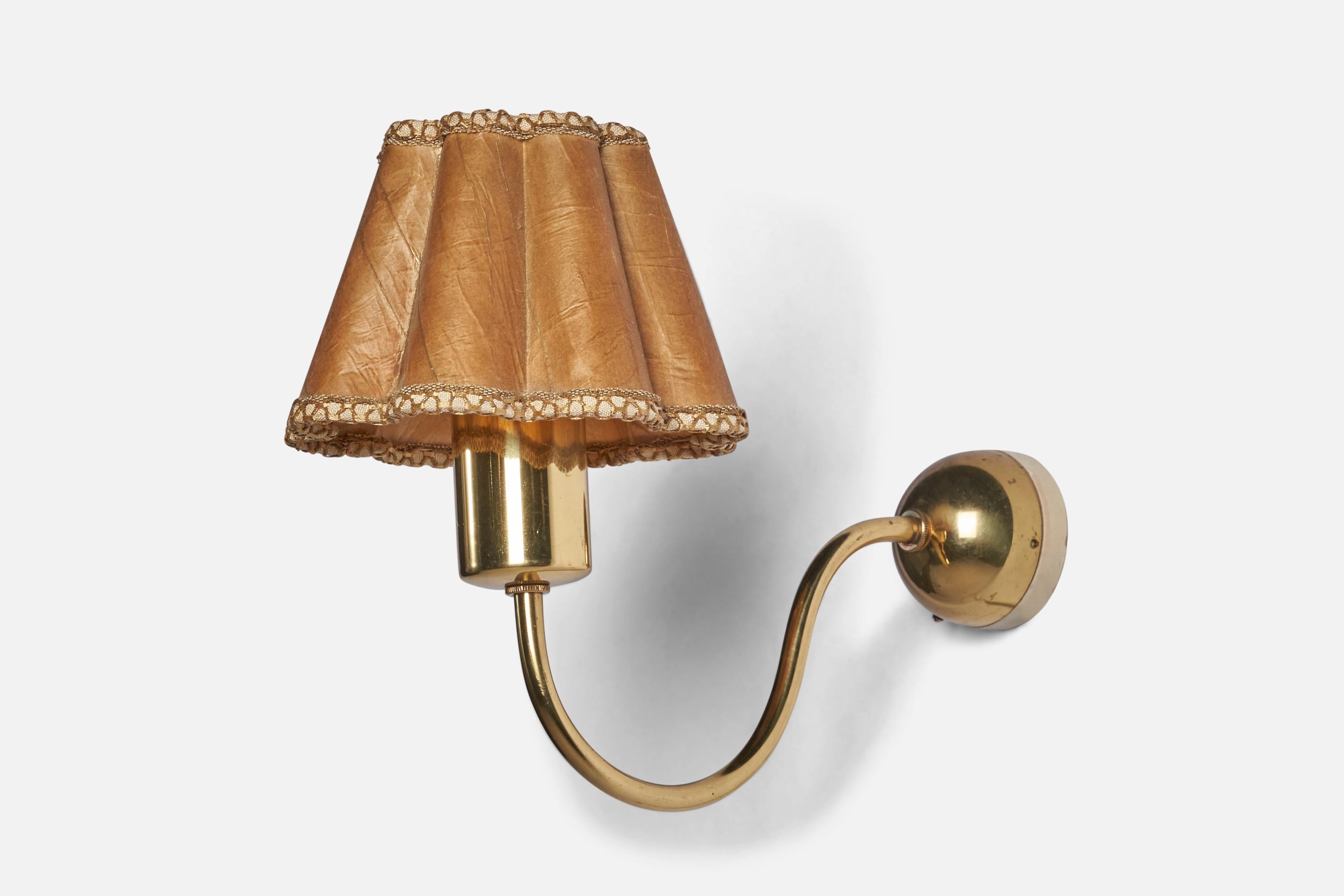 A brass and parchment paper wall light designed by Josef Frank and produced by Svenskt Tenn, Sweden, 1950s.

Overall Dimensions (inches): 9” H x 6” W x 11.5” D
Back Plate Dimensions (inches): 2.5” Diameter
Bulb Specifications: E-26 Bulb
Number of