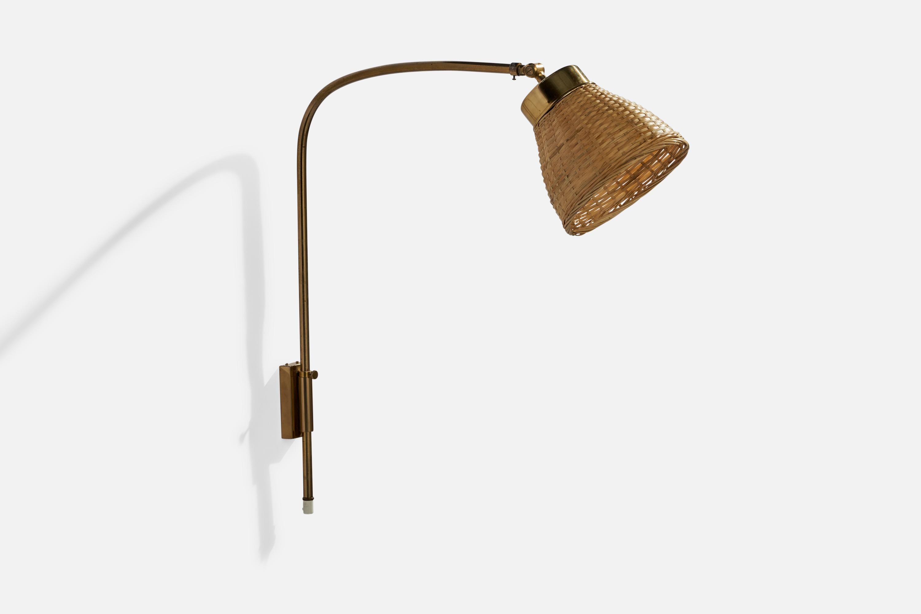 An adjustable brass and rattan wall light designed by Josef Frank and produced by Svenskt Tenn, Sweden, 1950s.

Overall Dimensions (inches): 23” H x 14” W x 17”  D
Back Plate Dimensions (inches): 4” H x 1.5”  W x .75” D
Bulb Specifications: E-26