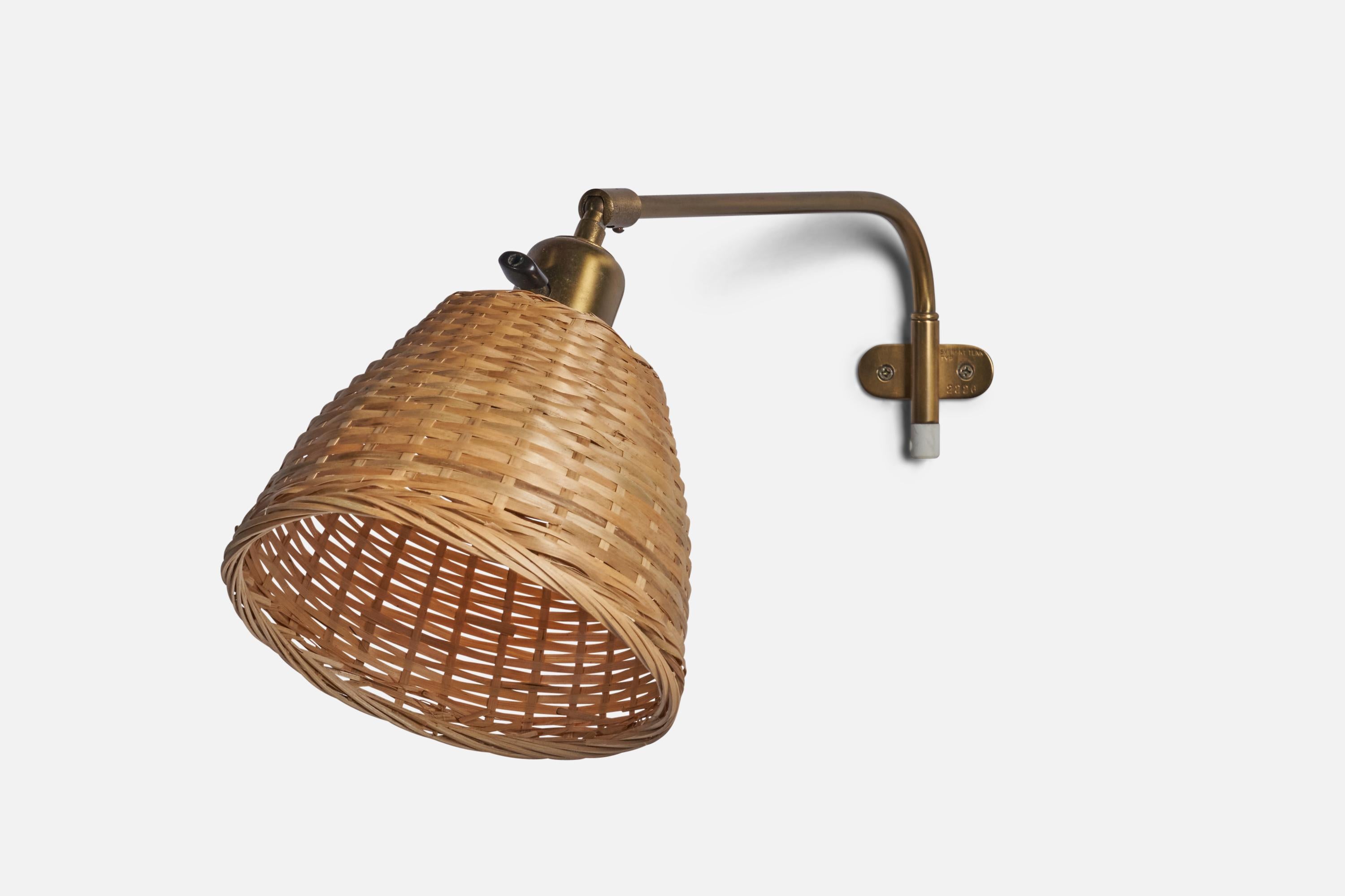 An adjustable brass and rattan wall light designed and produced in Sweden, 1950s.

Configured for plug-in with cord feeding from bottom of stem.

Overall Dimensions (inches): 20” H x 7” W x 9” D
Back Plate Dimensions (inches): 0.95” H x 2.3” W 
Bulb