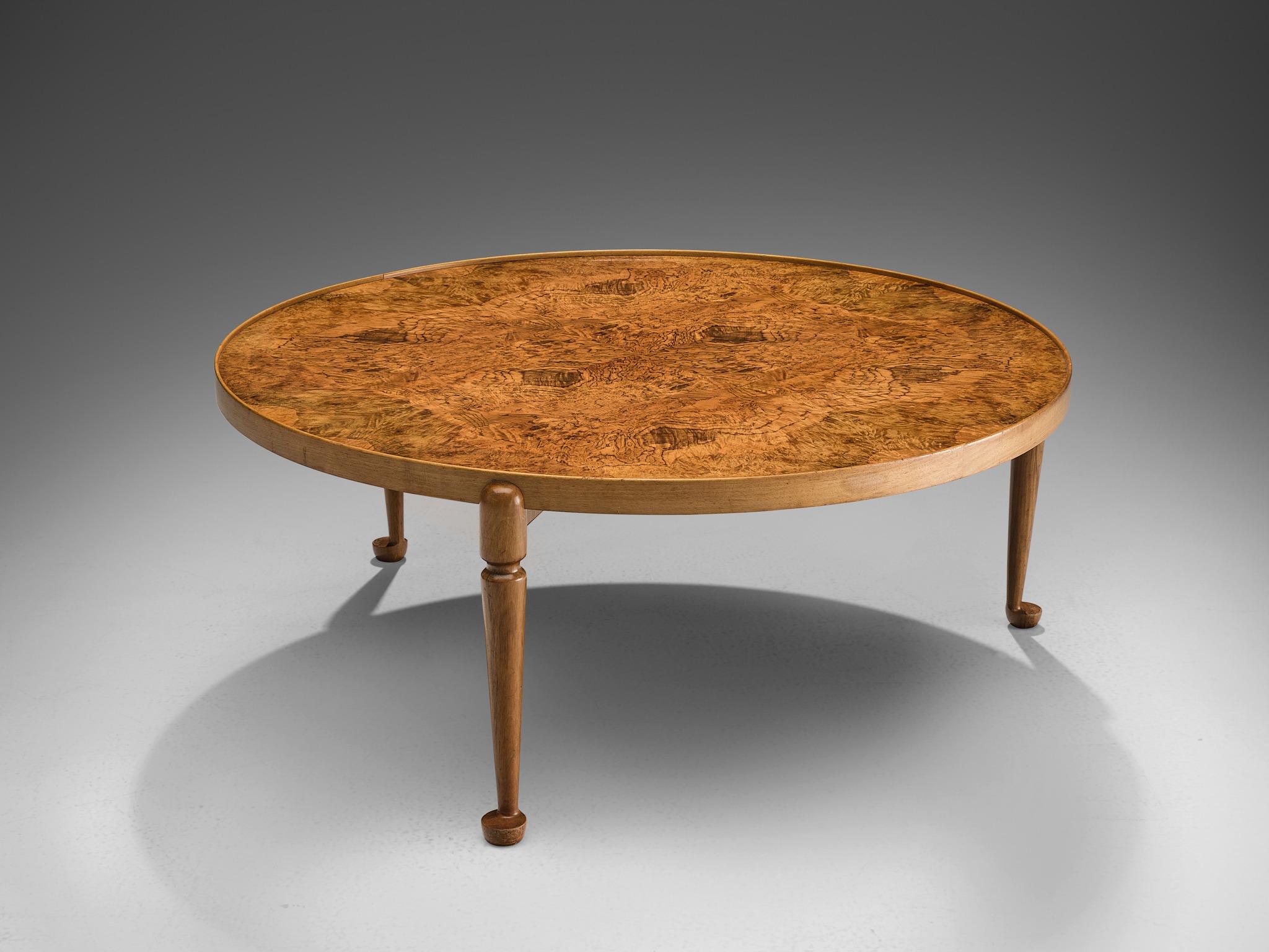 Josef Frank for Svenskt Tenn, coffee table model 2139, walnut legs and rim, amboyna burl top, design 1948, production later, Sweden.

This classic coffee table is designed by Josef Frank, circa 1948. The table features a burl amboyna top and