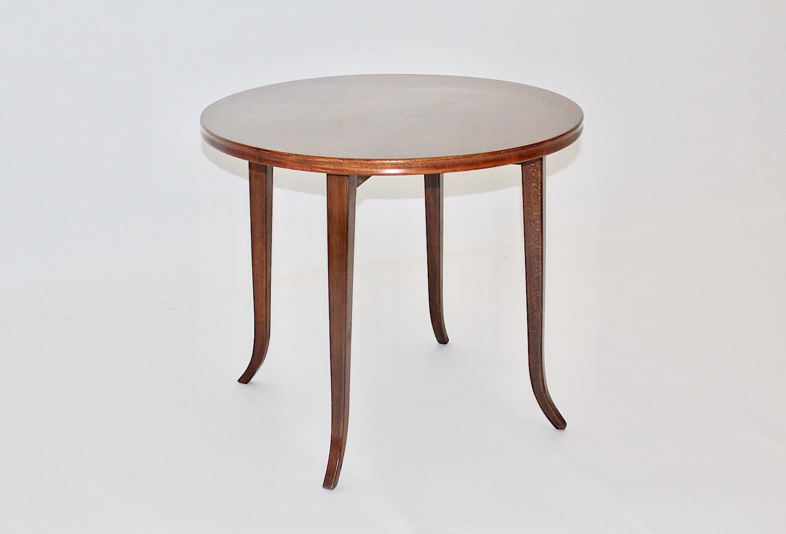 Josef Frank walnut vintage round shape coffee table, which was designed and manufactured 1930s for Haus & Garten, Austria.
A beautiful and elegant circular shape of the coffee table, which fit to your home interior throughout its warm brown walnut