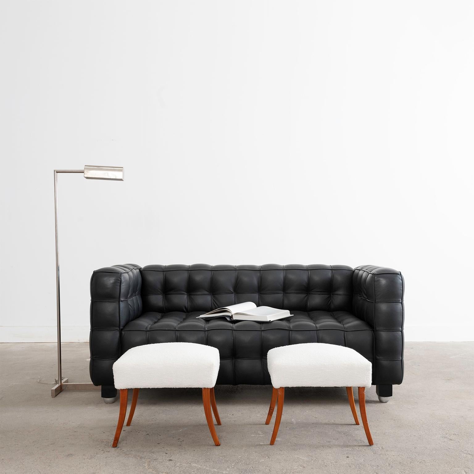 Dramatic modern sofa or settee attributed to Josef Hoffmann for Wittmann, Austria. The geometric cube motif sofa features soft black leather seating surfaces fitted like a fine Italian suit. Excellent joinery and craftsmanship with a lightly aged