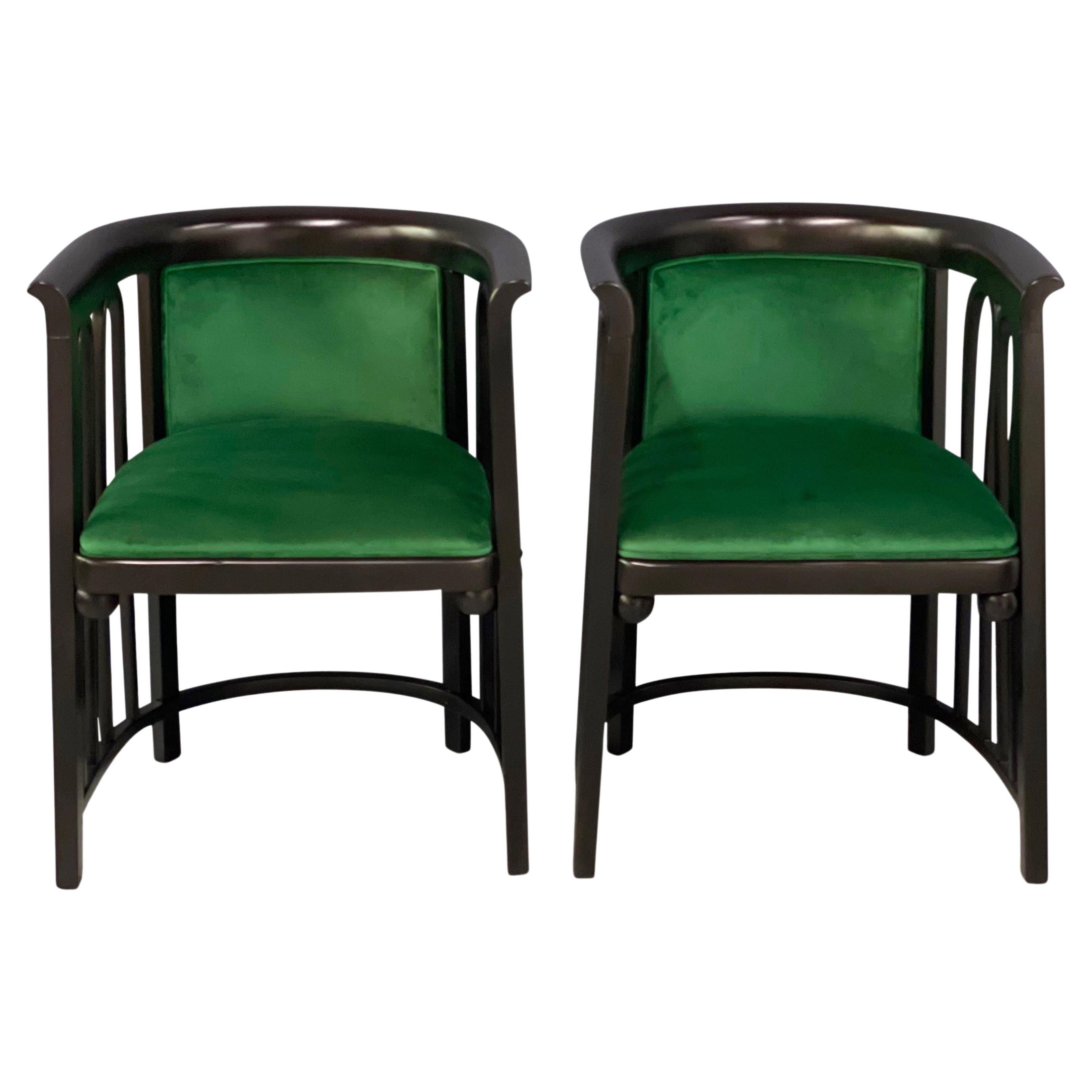 These lounge chairs from the early 1900s have an unusual bentwood design that makes them extremely rare. They have been reupholstered in a beautiful emerald green velvet and also the frames have been refinished in a satin black finish.