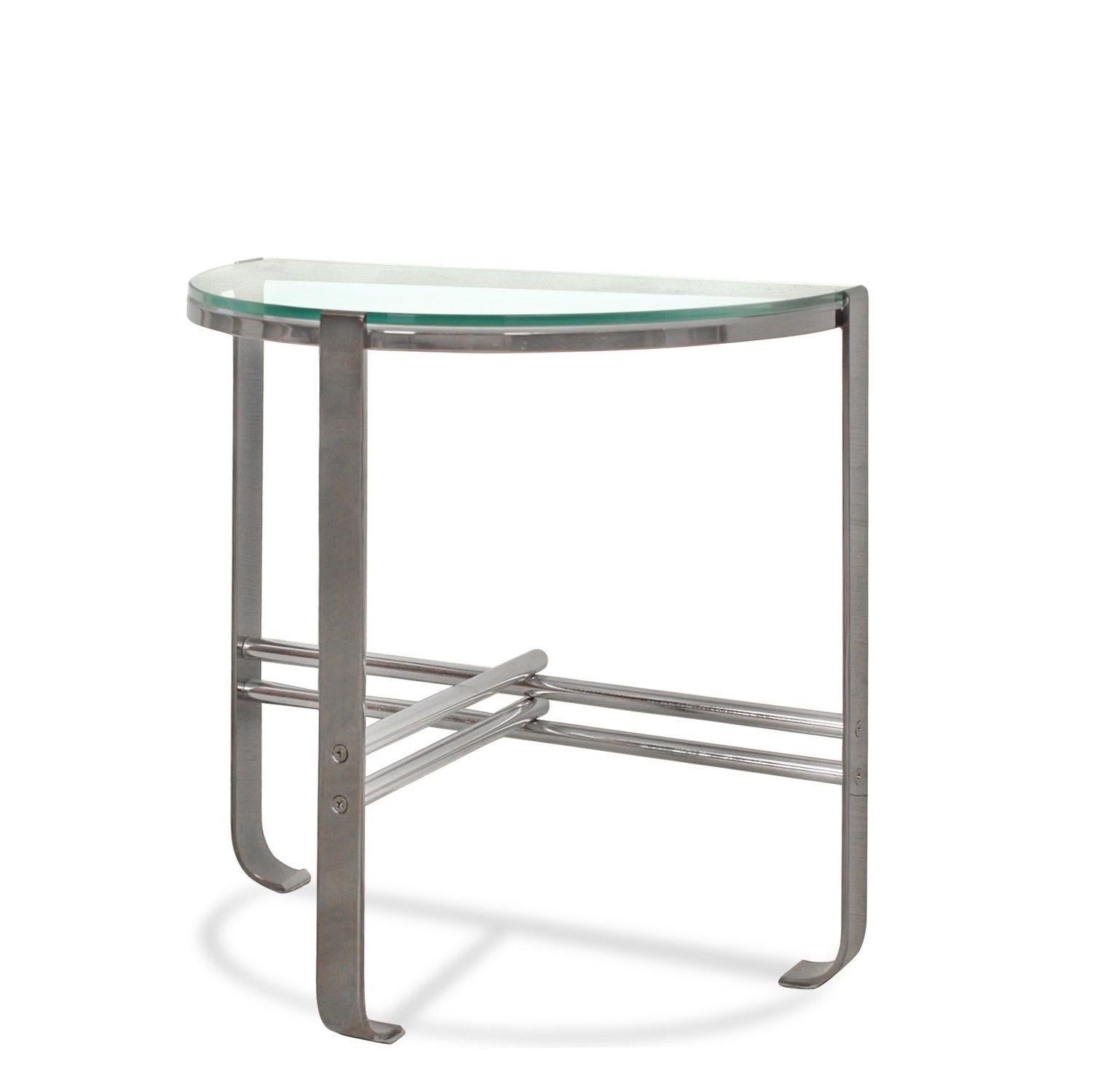 A vintage chromed metal demi-lune hall table inset with a glass top.  In the style of Josef Hoffman.

Dimensions: 22.5” L x 12” D x 22” H