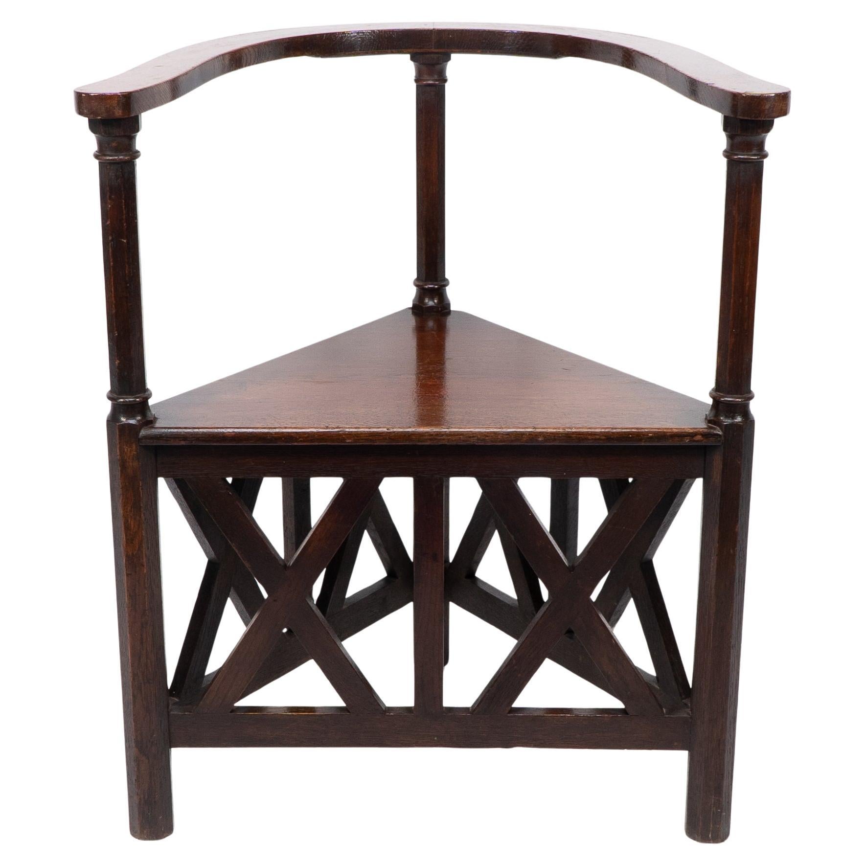 Josef Hoffmann (1870-1956) designed for the 5th Viennese Secession exhibition in 1899.
An exceptional oak corner armchair. 
The last image is of an identical armchair designed by Hoffmann which was exhibited at the Tate, Liverpool, in the 'Gustav