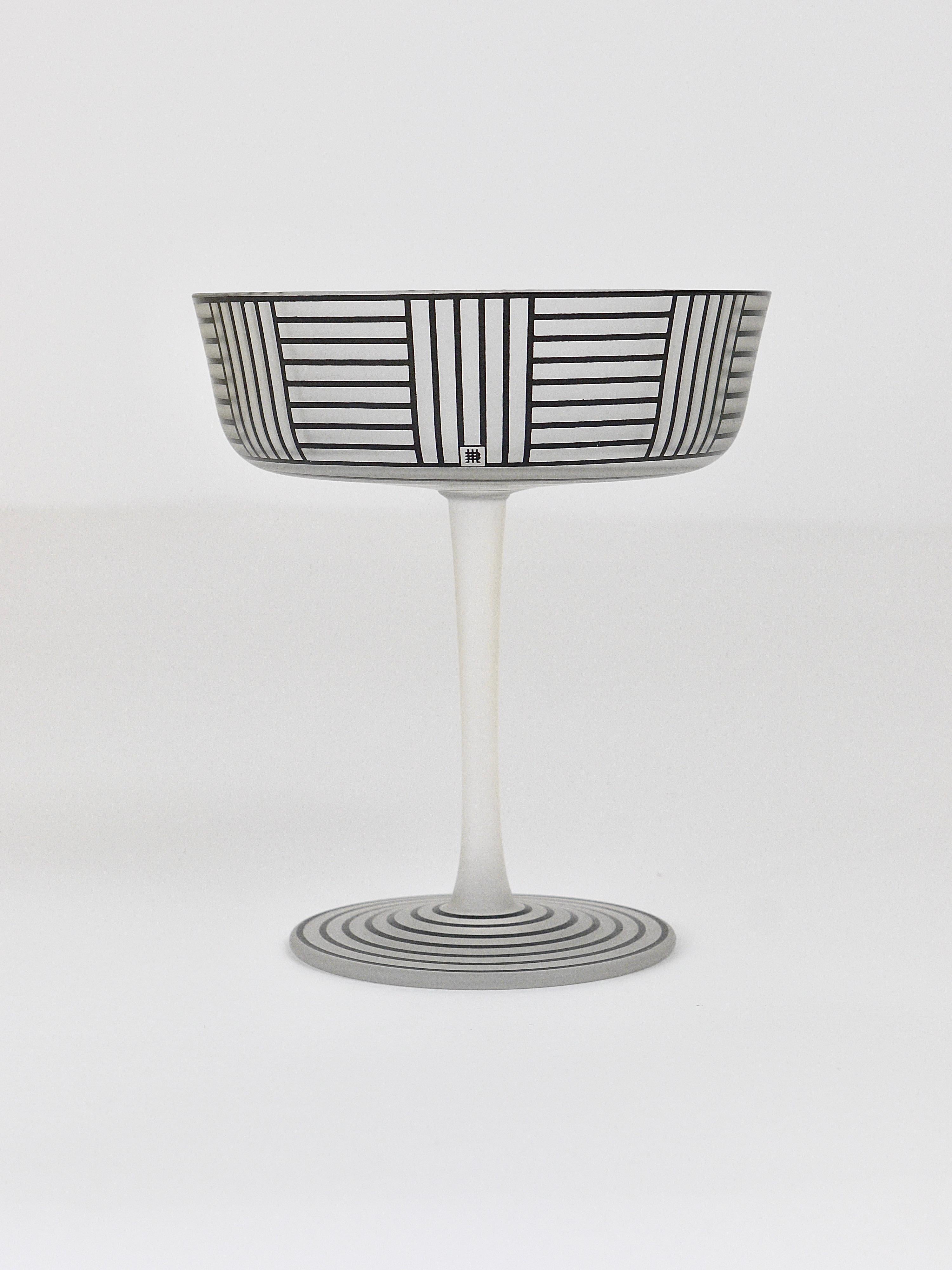 A beautiful and elegant champagne cup, designed by Josef Hoffmann in 1912. Completely handmade of Fine satined, frosted muslin glass, mouth-blown in a wooden mold with a wonderful geometric enamel bronzit decoration. Executed by J. & L. Lobmeyr in