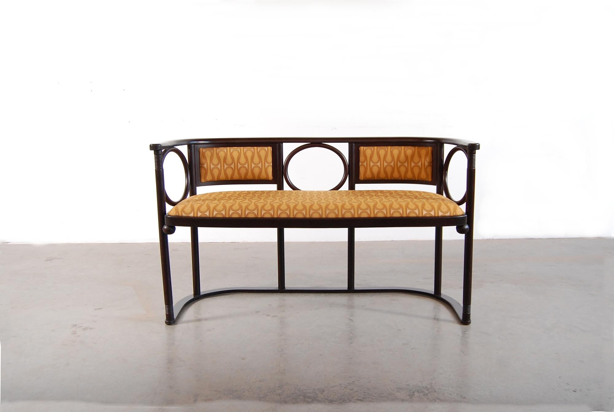 Josef Hoffman bench, designed circa 1905. This example, produced in Austrian by Wittmann in the 1980s. Newly upholstered in fabric that was designed by Josef Hoffmann, circa 1908, and recently re-produced by Maharam.