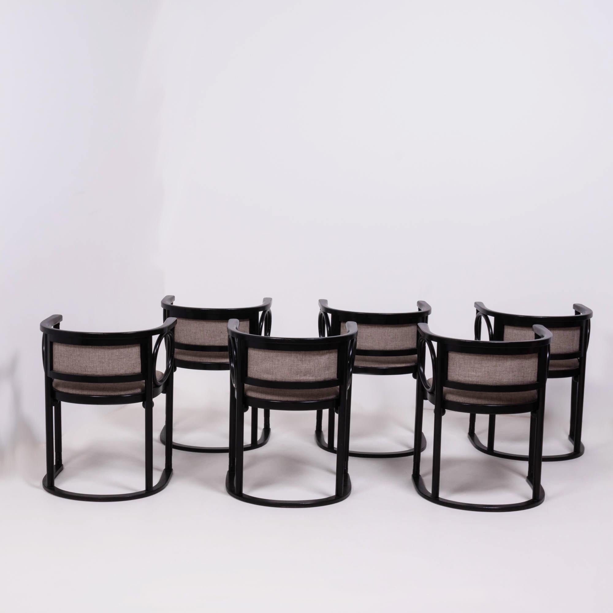 Designed by Josef Hoffmann in the 1930s, these chairs were made by Wittmann in Austria in the 1980s to the original specifications. 

A fantastic example of Art Deco design, these bentwood chairs feature black curved frames with newly upholstered