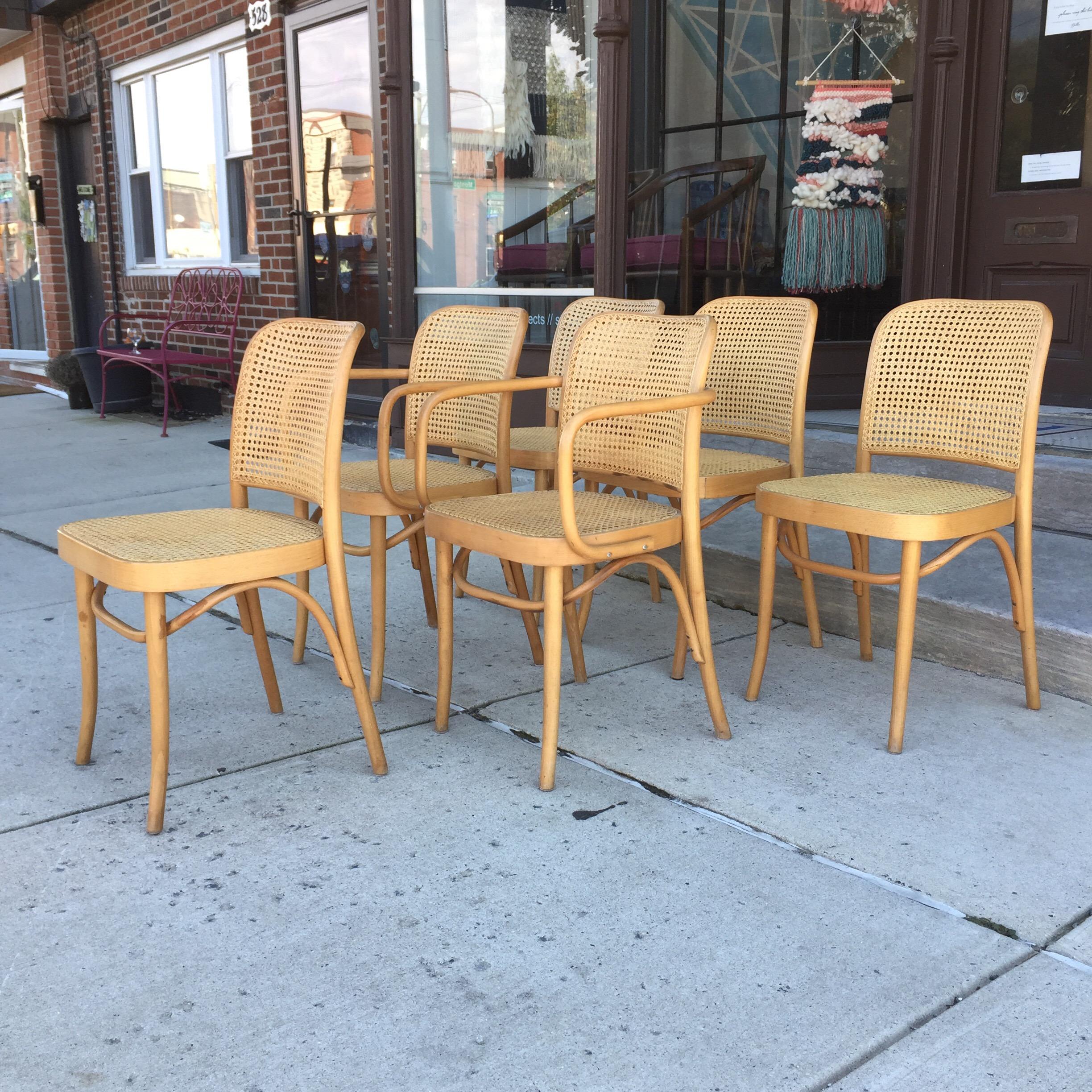 Lovely set of six vintage dining/bistro chairs designed by Josef Hoffman. Caning and bentwood are sturdy and intact. Legs show slight scuffing from use, but present beautifully. 4 side chairs and two armchairs.
