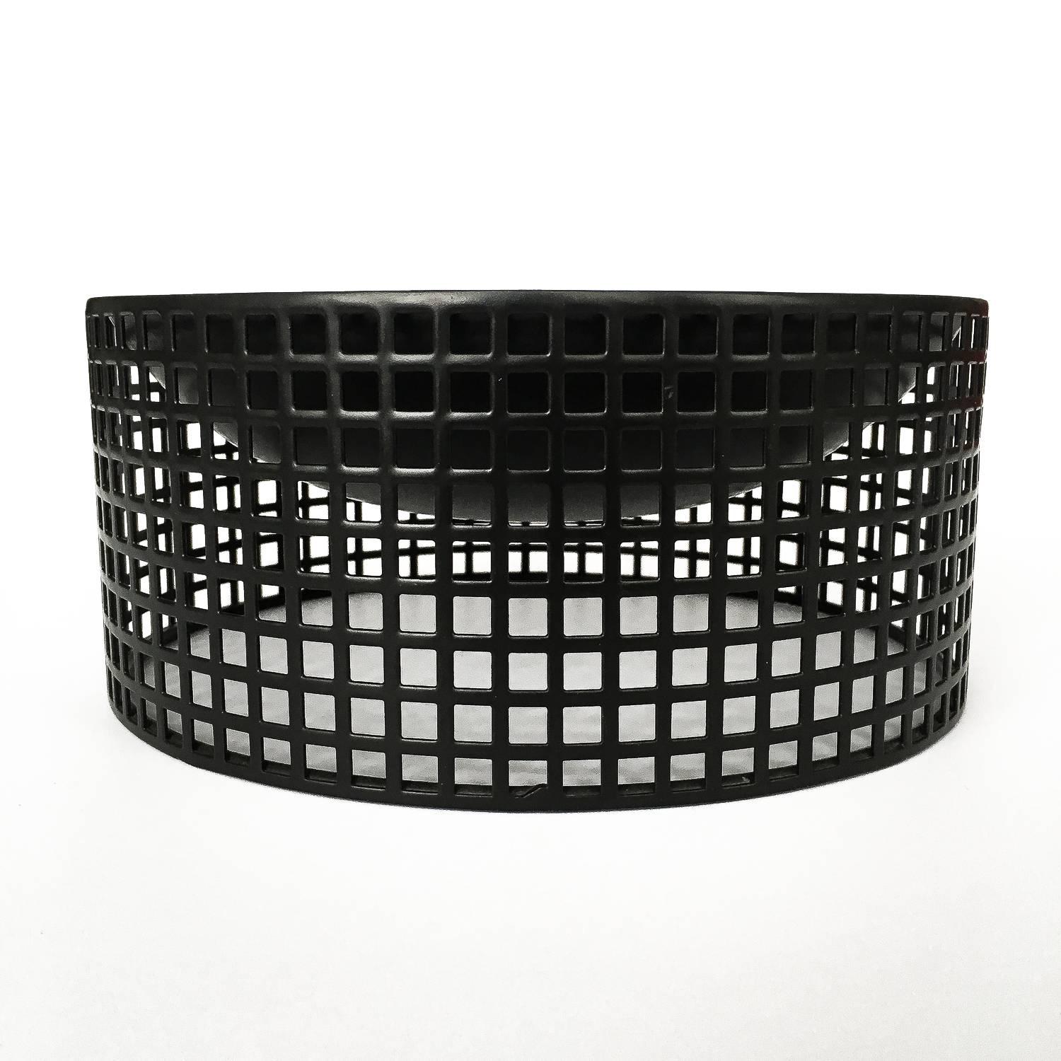 A 1980s reissue of the centrepiece fruit bowl by Josef Hoffmann (1870-1956) for Bieffeplast. The bowl was originally produced in 1904 by the Wiener Werkstätte founded by Josef Hoffmann in 1903. The bowl is made of black perforated metal that