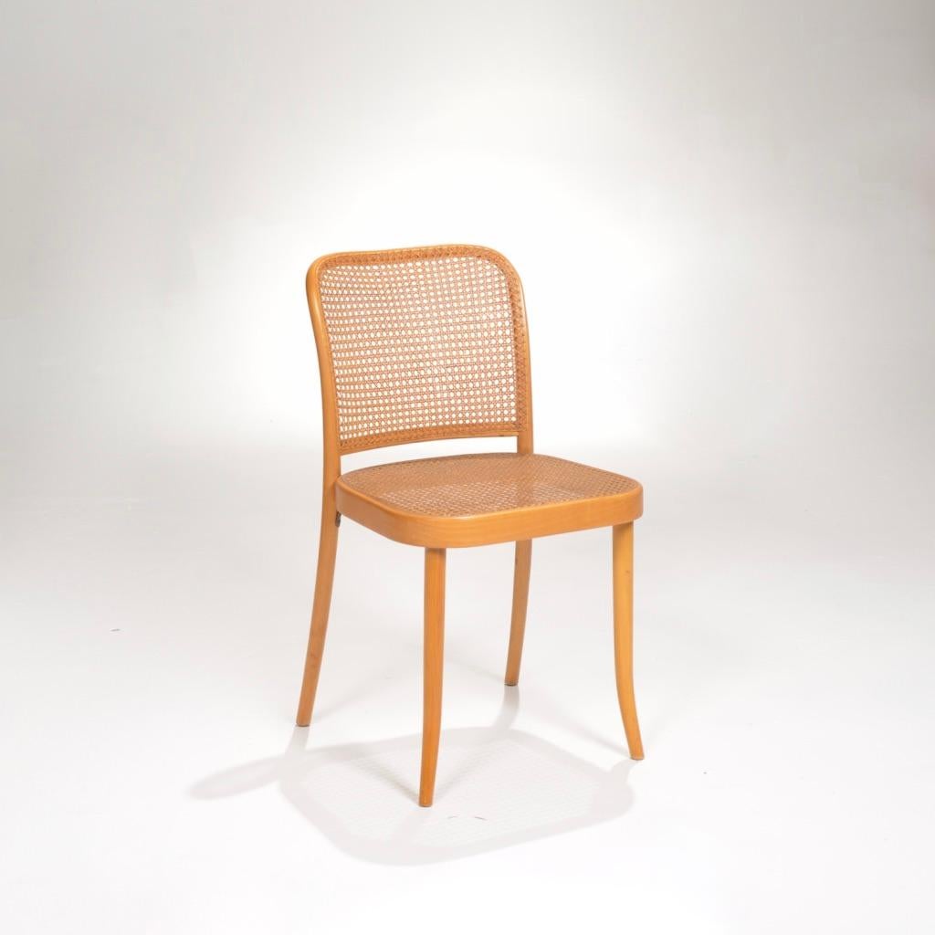Set of six cane dining chairs by Josef Frank and Josef Hoffmann for Stendig. Two with arms, four without. They feature minimal bentwood sturdy frames in birch with handwoven cane seats and backs. 
Made in Czechoslovakia. Chairs are signed on