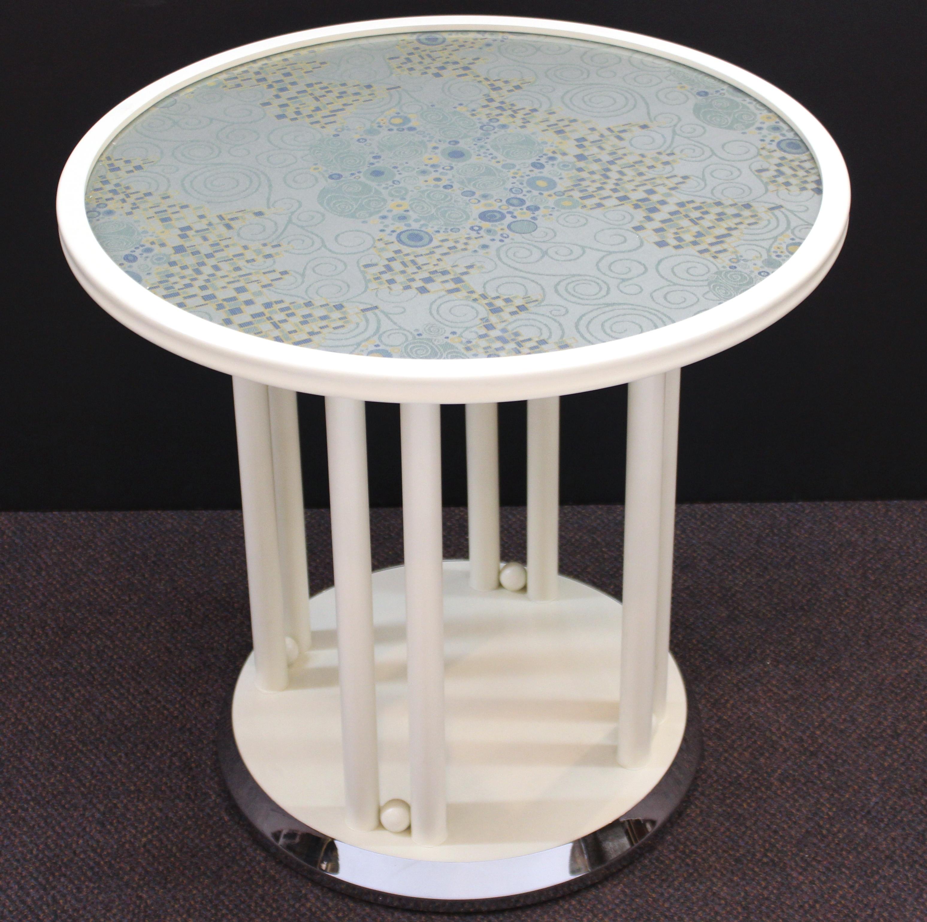 Viennese Secessionist 'Fledermaus' table in white, originally designed in 1907 for the Viennese Fledermaus cabaret by Josef Hoffmann and manufactured by Wittmann. The piece has a Secessionist style textile inlay underneath the circular glass top and