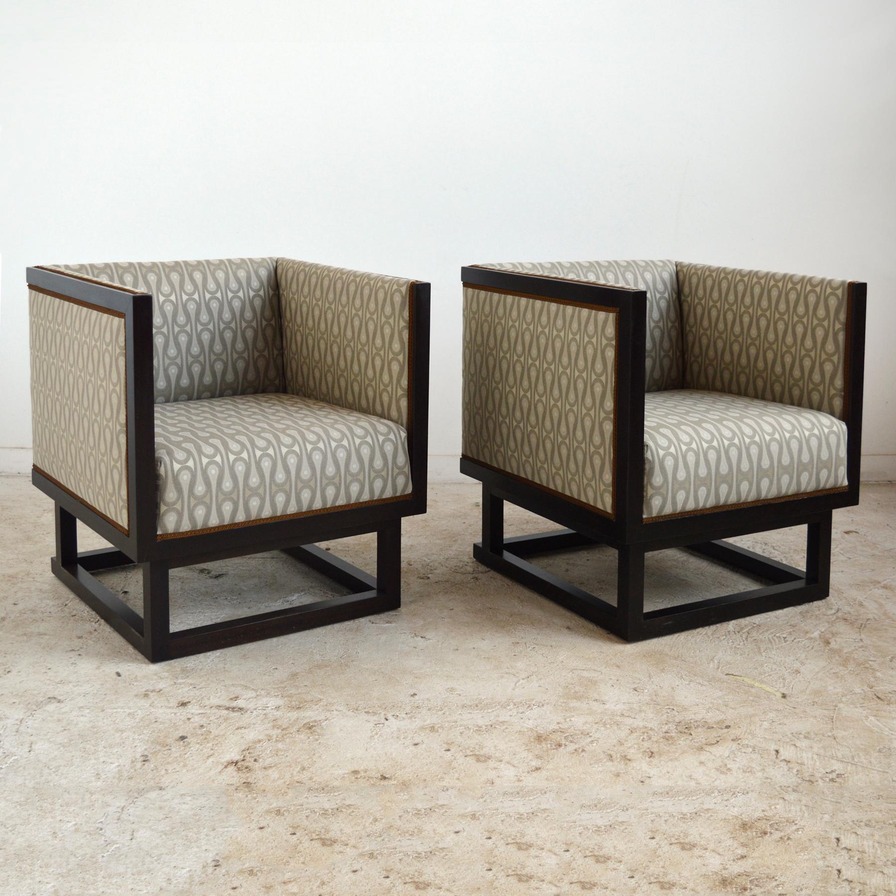 Designed in 1903, for the Vienna home of Dr. Salzer, Josef Hoffmann's cabinet chairs are a timeless design that typifies his Wiener Werkstätte aesthetic. The rationalist cube form is made comfortable with the upholstered interior that's covered in