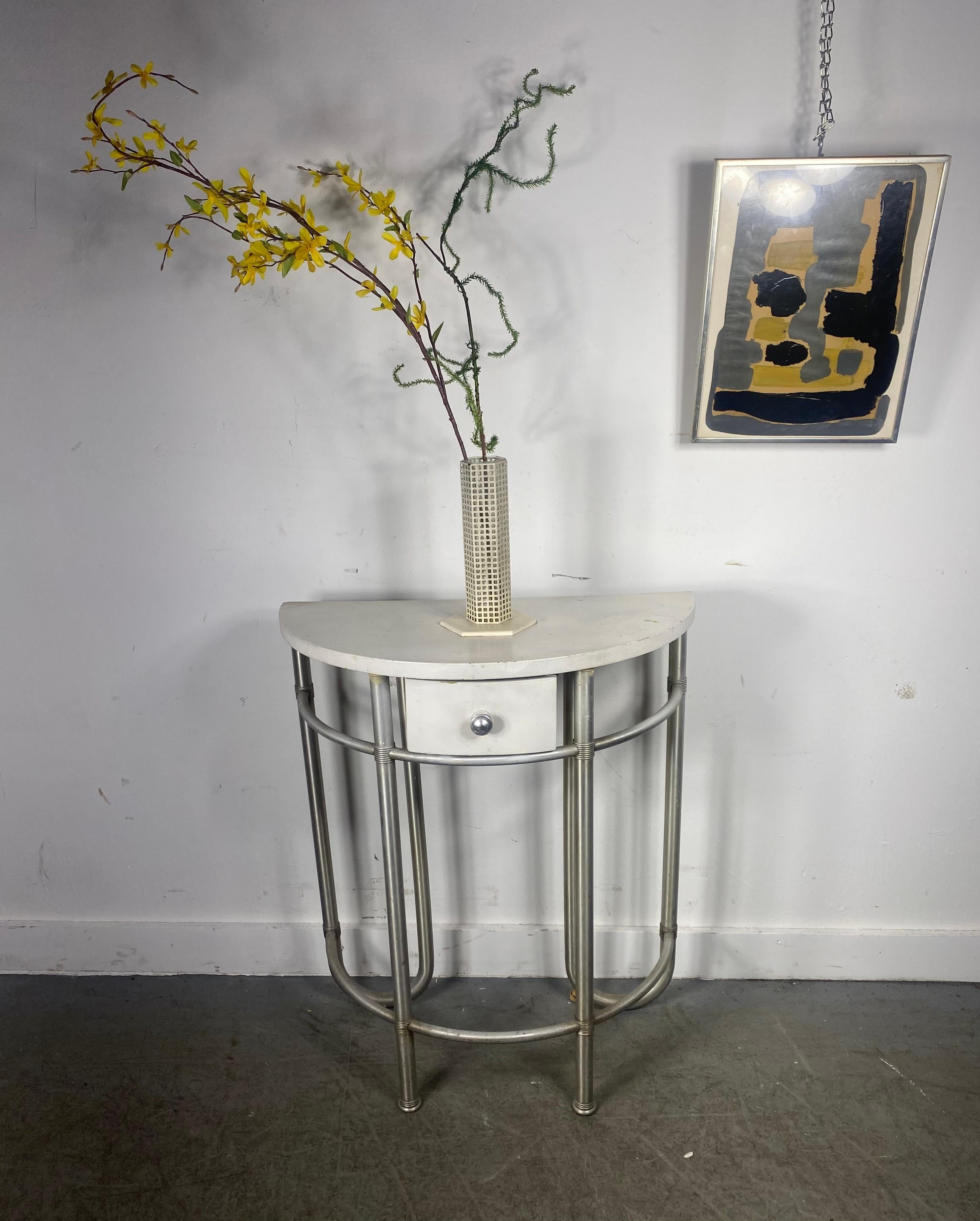 Josef Hoffmann, Flower vase in metal and glass.

This iconic flowers vase, originally designed in the early 1900s, this specimen was reissued by the Bieffeplast company in the 1980s and bears the authenticity label on the bottom.. minor chip to