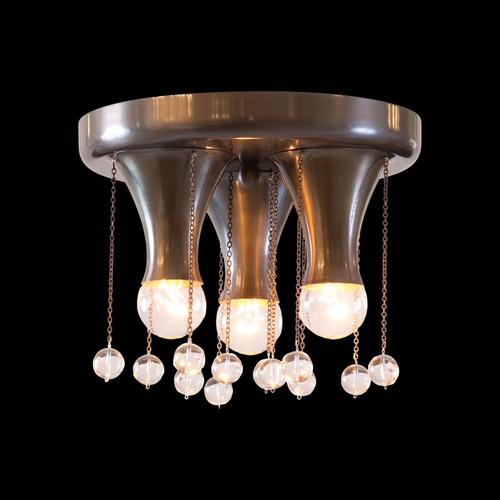 Flush - lamp from the showrooms of the Wiener Werkstaette used by Hoffmann in several variations. Hammered originally. Works-number M115, pattern-book of the Wiener Werkstaette: WWMB 3 p. 256-257.

USA and CAN:
All electrical components according to