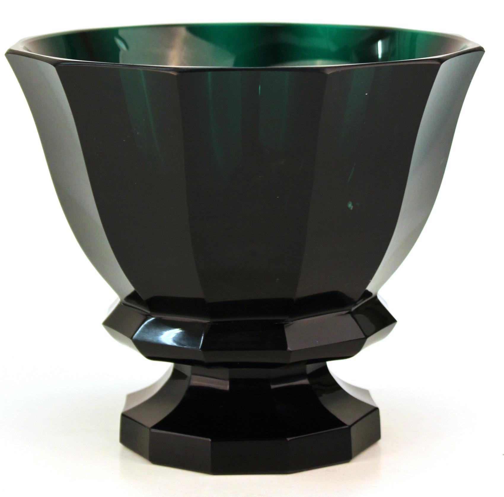 Austrian Wiener Werkstatte secessionist glass vase in dark green glass designed by Josef Hoffmann, circa 1916. The faceted and footed vase bears the acid mark of the Wiener Werkstatte on the bottom of its foot. Aside from a small flea-bite on the