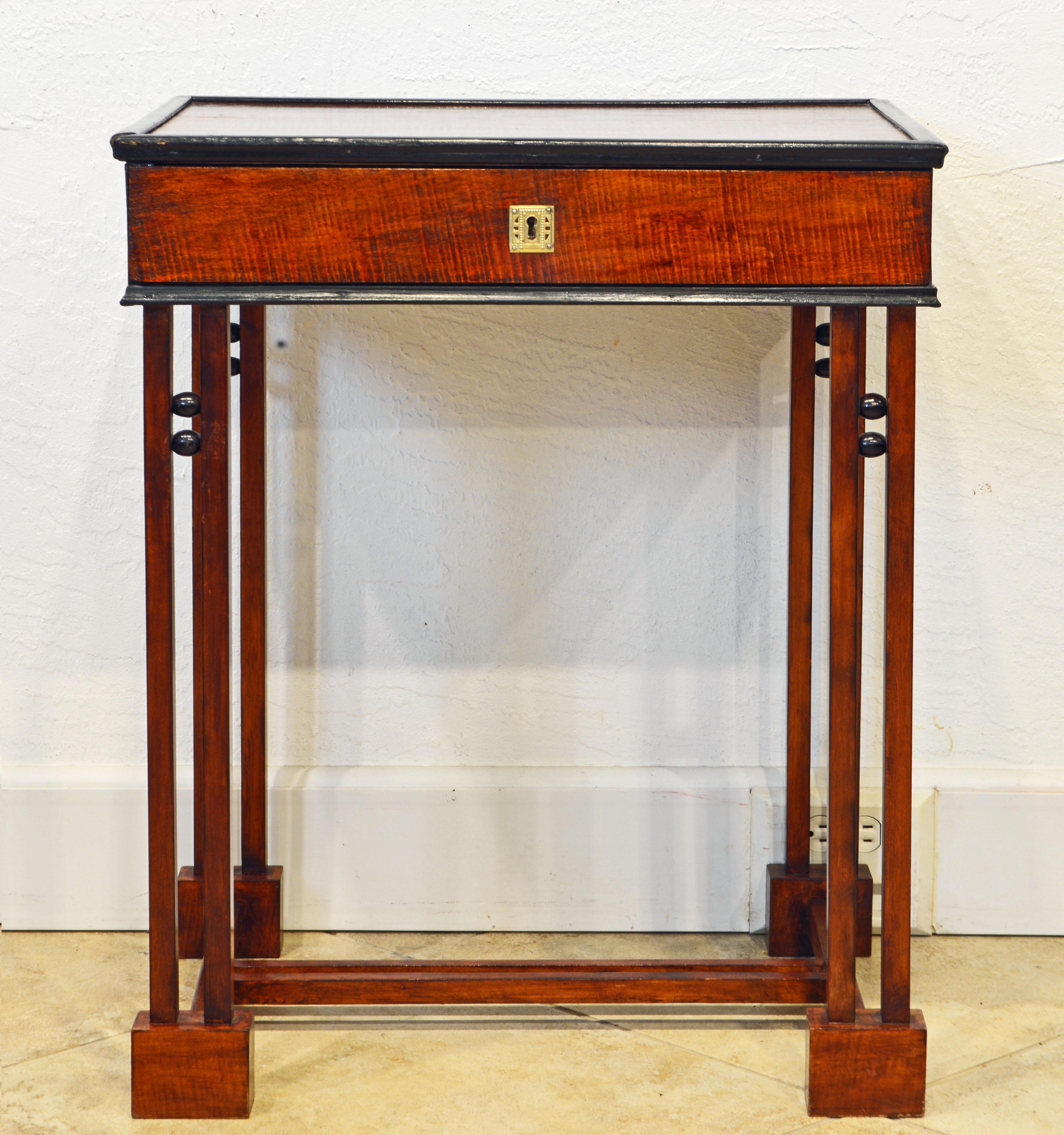 This one-drawer tiger maple and ebonized side table or work table bears the original 'Josef Hofmann Succ. Bielitz Austria' label. It embraces several of both Secessionist and Wiener Werkstatte new ideas of design. The tiger maple top with ebonized