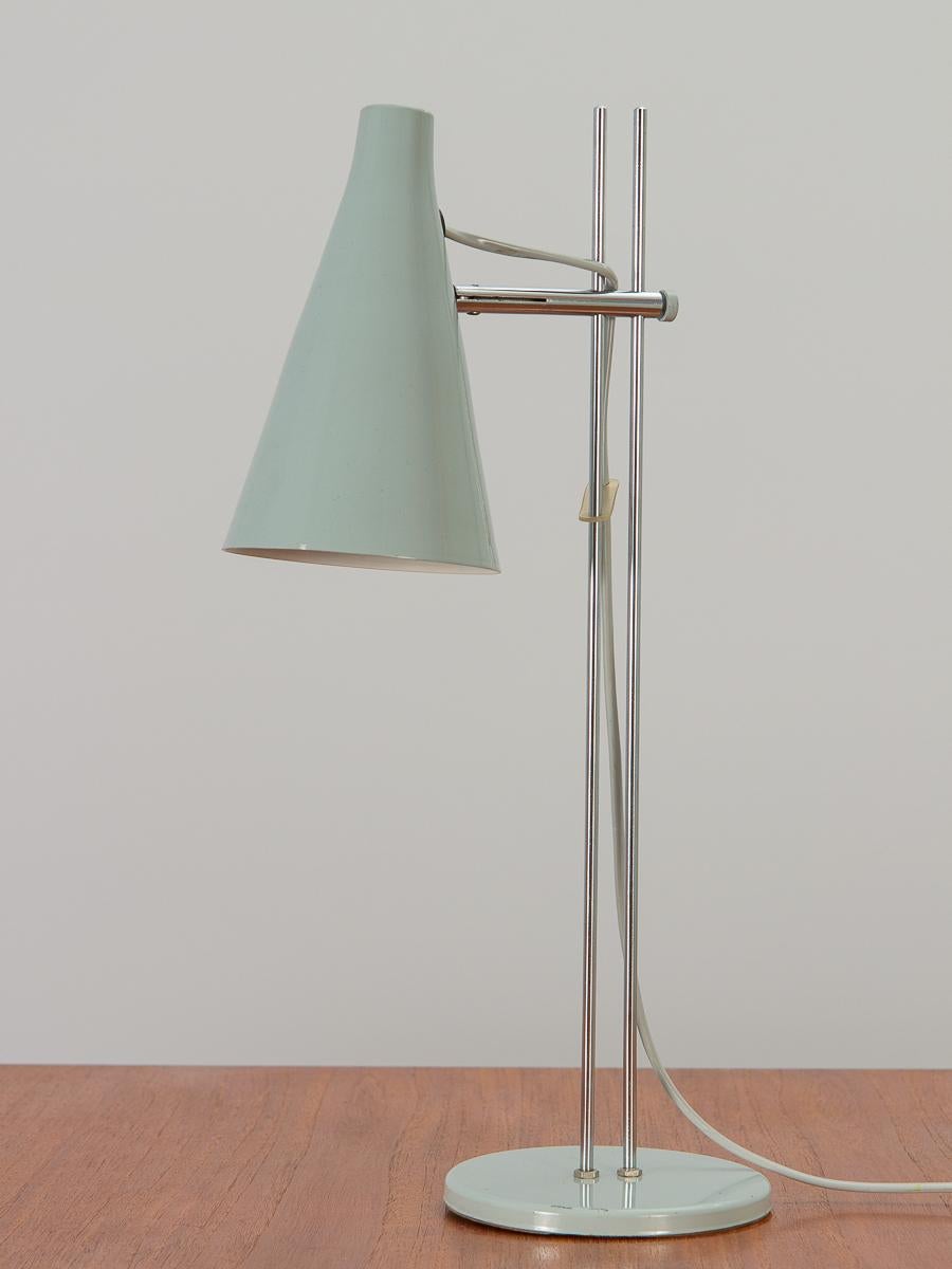 Model L194 task lamp in slate gray, designed by Josef Hurka for Lidokov. A sleek and functional table lamp with industrial charm. Conical shade is fully adjustable and can be lowered on the two steel rods that support it. In excellent vintage