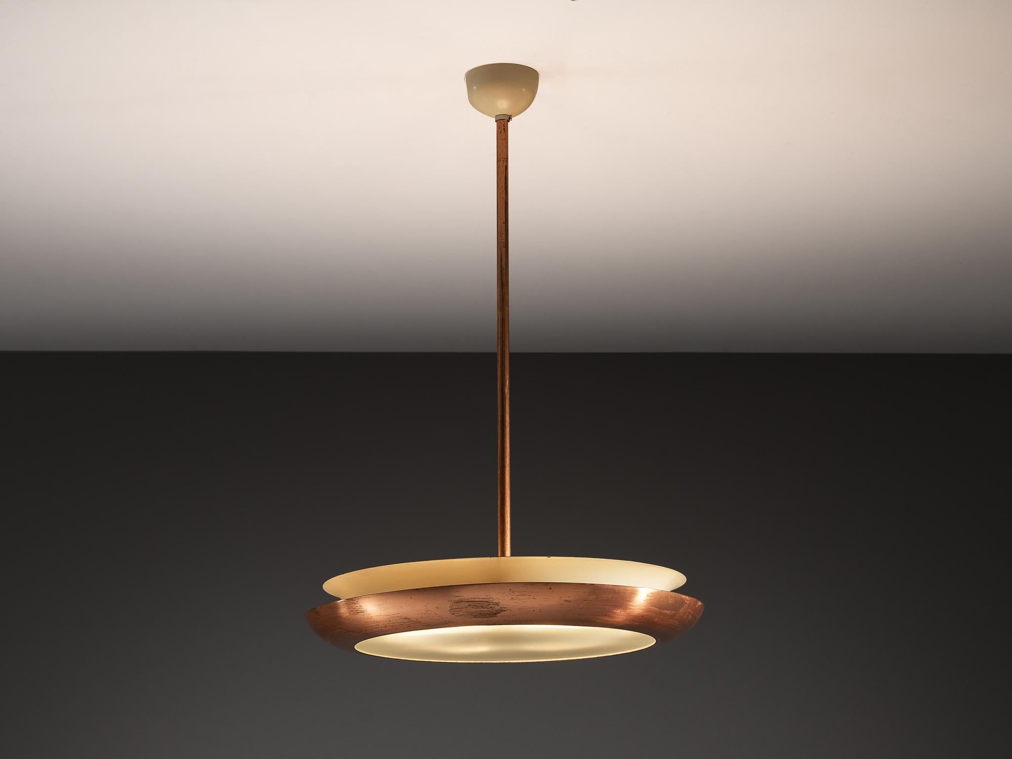 Josef Hurka for Napako, copper, glass, Czech Republic, 1940s

The ceiling light pendant created by Josef Hurka has a sleek and modern design, characterized by an industrial aesthetic. The primary body of the light resembles a flattened, disc-like