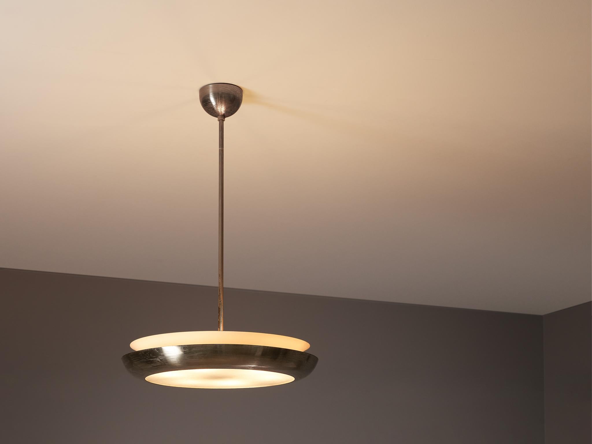 Josef Hurka for Napako, 'Ufo' pendant, metal, glass, Czech Republic, 1940s

Josef Hurka designed this pendant for Napako. The pendant has a bowl shaped shade executed in metal. A matte diffuser creates an atmospheric, soft light partition and