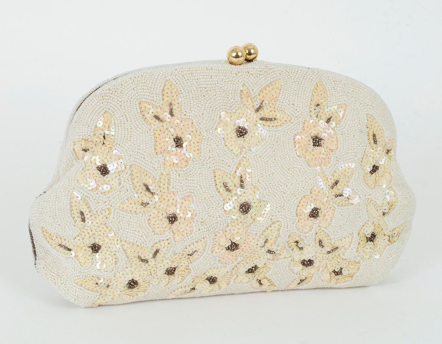 Completely hand beaded, this ladylike evening clutch by the coveted French brand Josef features a pavé caviar ground punctuated by ivory sequin flowers with gold bead centers both front and back. Despite its painstaking and delicate craftsmanship,