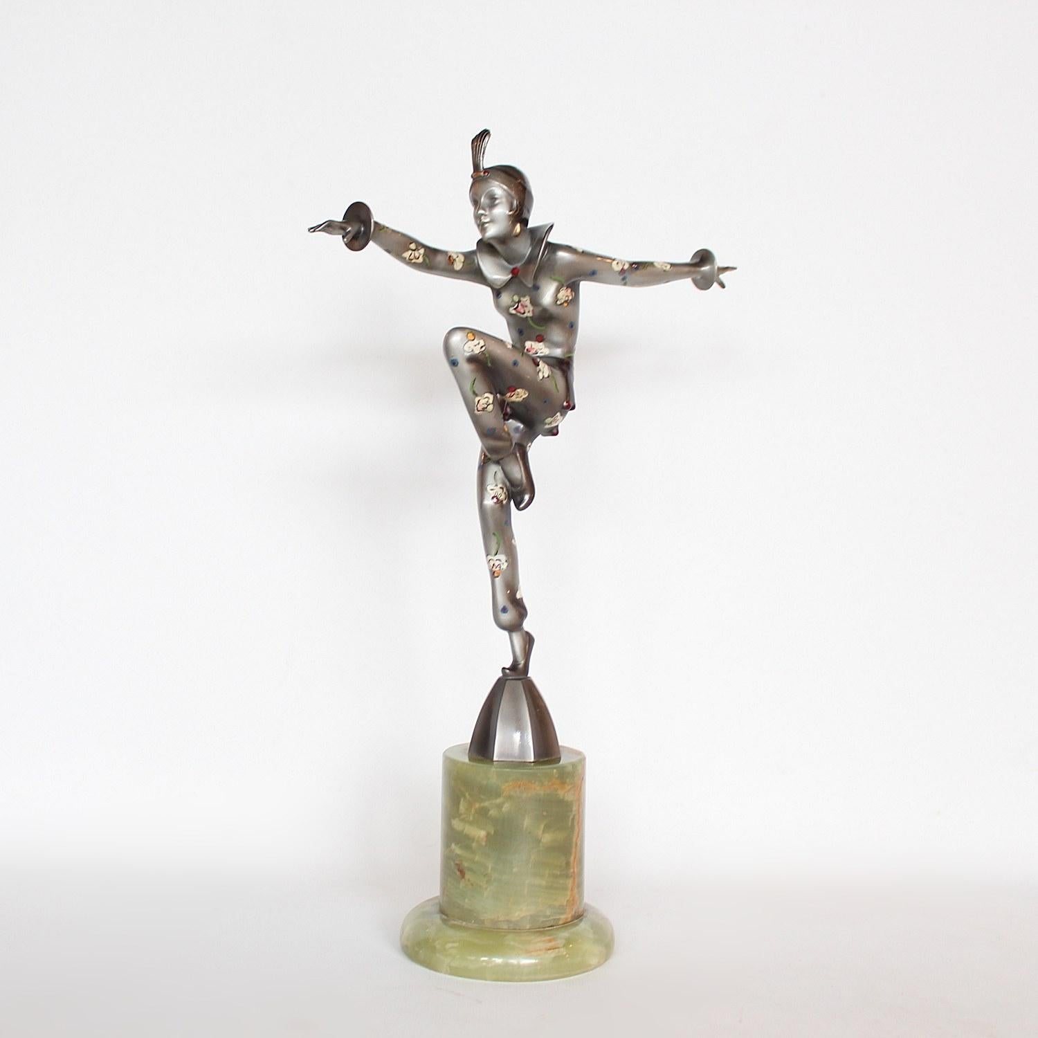 Con Brio, an Art Deco, cold painted bronze figure. A dancing woman in stylised pose set over a green onyx plinth, decorated with enamel painted flowers, signed Crejo to jacket. 

Signed Lorenzl to bronze

Artist: Josef Lorenzl