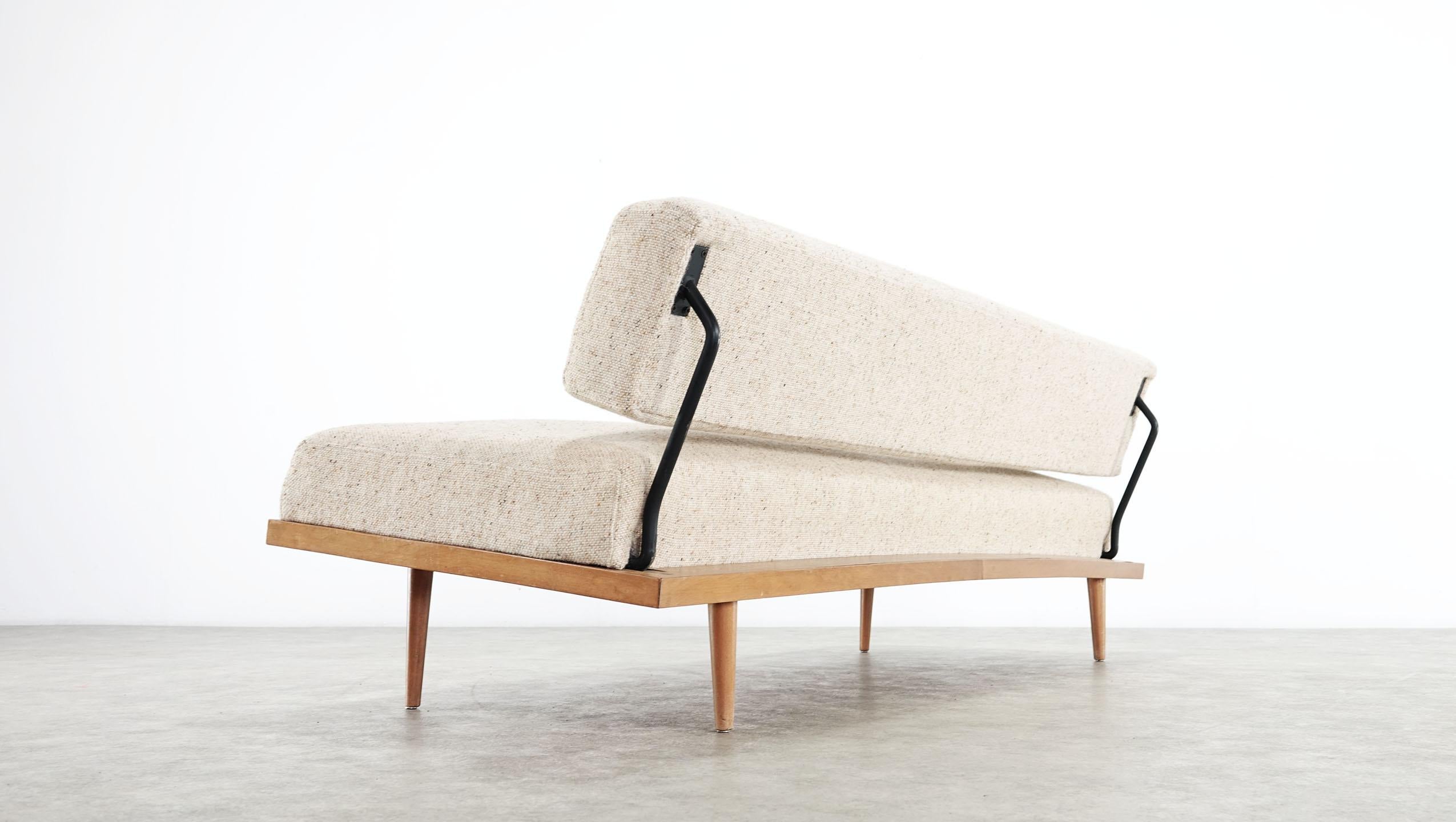 Nice Minimalist daybed designed by Josef Pentenrieder in 1954 and edited by Hans Kaufeld. Germany, circa 1950. Birch wood frame, feet and back in black lacquered tubular steel. This daybed sofa have been fully restored and newly upholstered with a