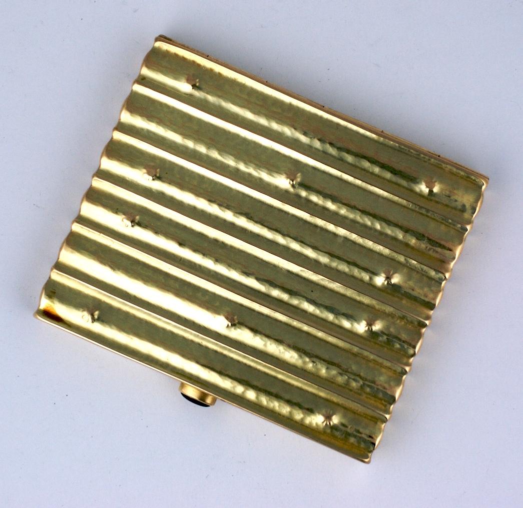 Rare and special Joseff Hoffmann Gold Cigarette Case for the Wiener Werkstatte, circa 1920's. Constructed of 14k gold in typically reeded pattern with hand peened finish with reverse punched star motifs from the interior. 
Marked with Austrian gold